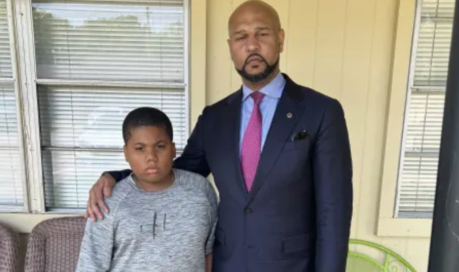 Aderrien Murry, 11, pictured with family attorney Carlos Moore, is recovering at home