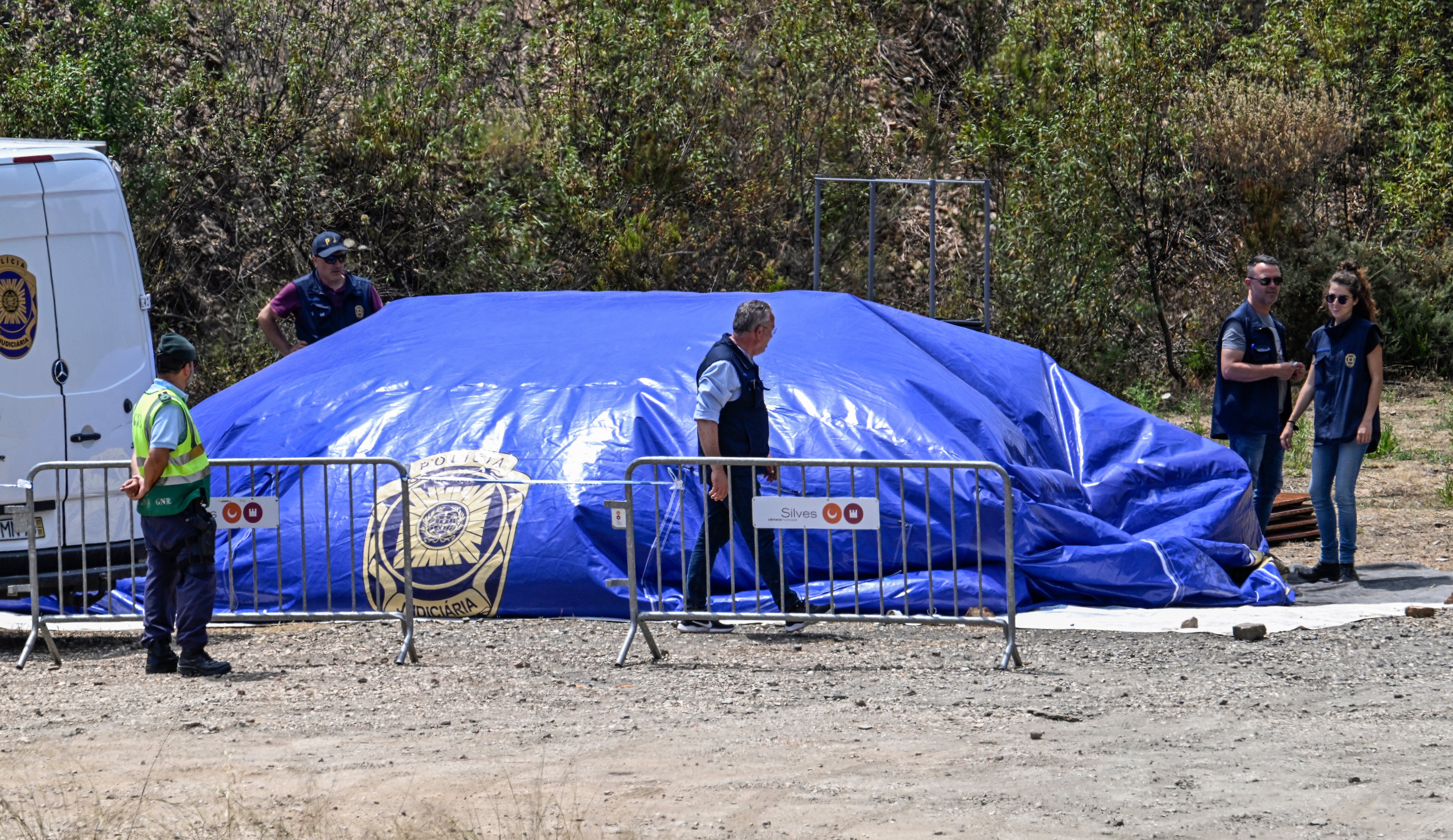 Portuguese police investigators dismantle base camp at the end of the three-day search for remains of Madeleine