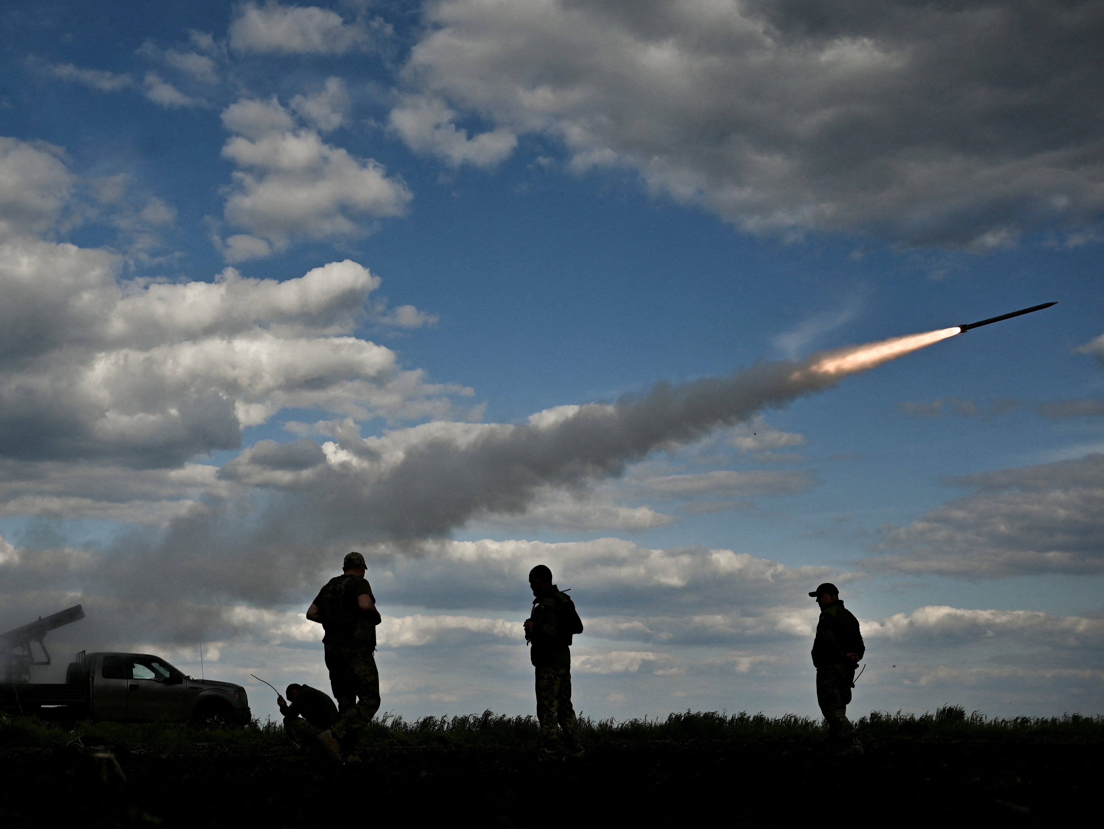 Ukrainian servicemen fire a Partyzan multiple launch rocket system towards Russian troops near a frontline in the Zaporizhzhia region