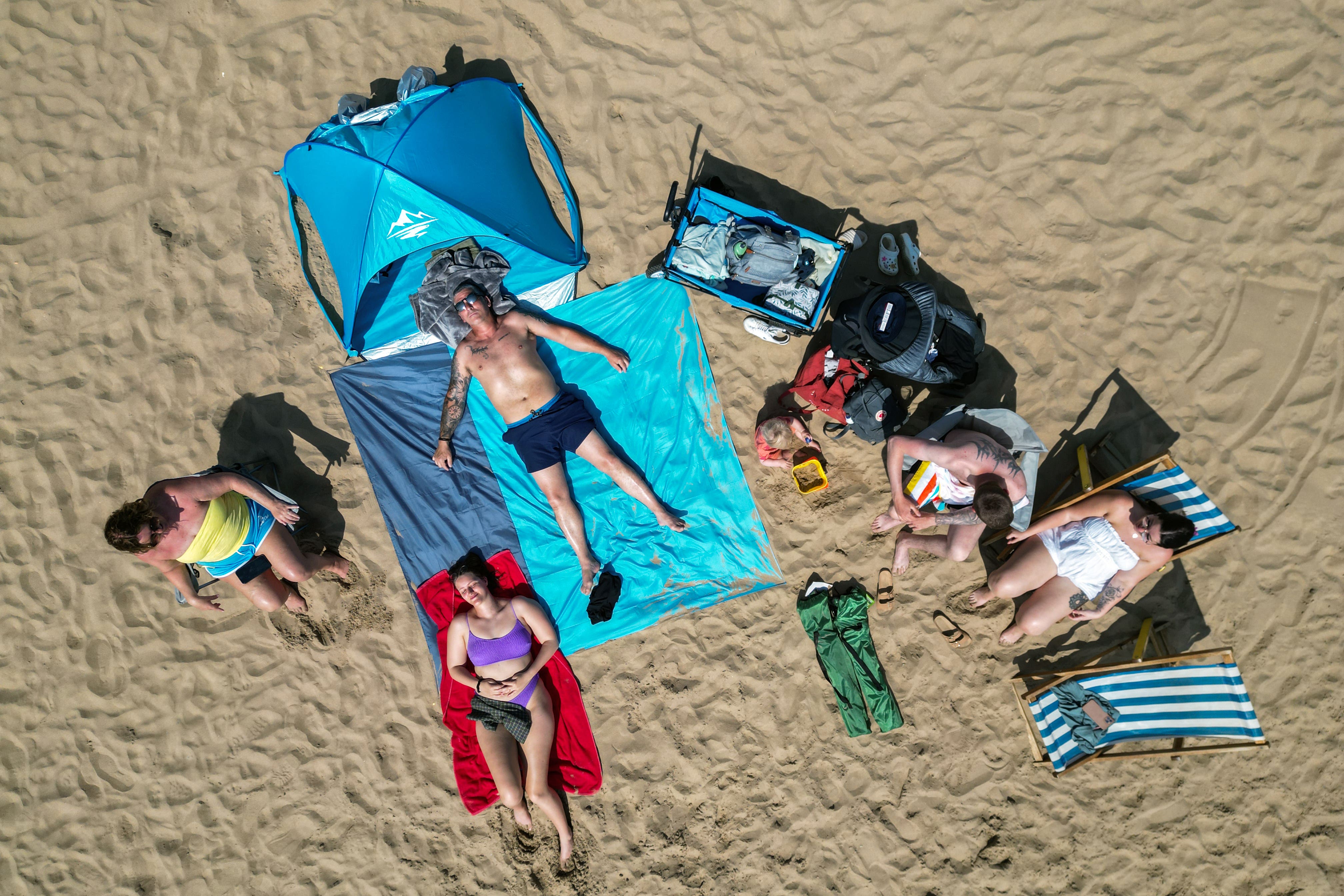 The warm weather is not expected to relent over the weekend, with highs of 24C possible in south-east Wales and around the Bristol Channel on Saturday and Sunday (Danny Lawson/PA)