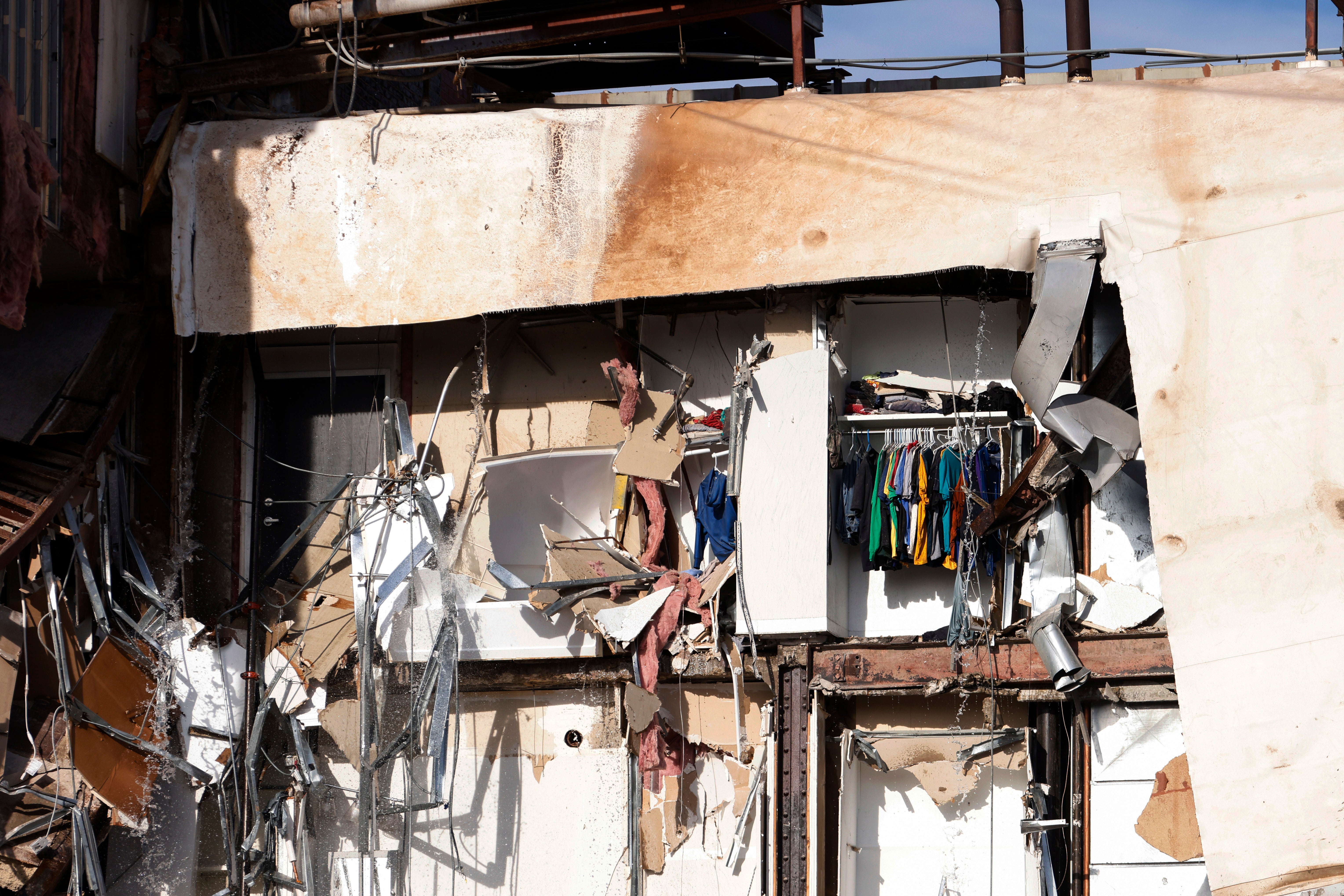 Emergency crews work the scene of a partial building collapse on the 300 block of West Third Street