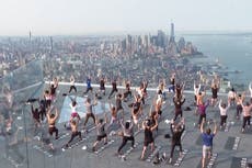 New Yorkers practice yoga on top of 100-storey skyscraper in Manhattan