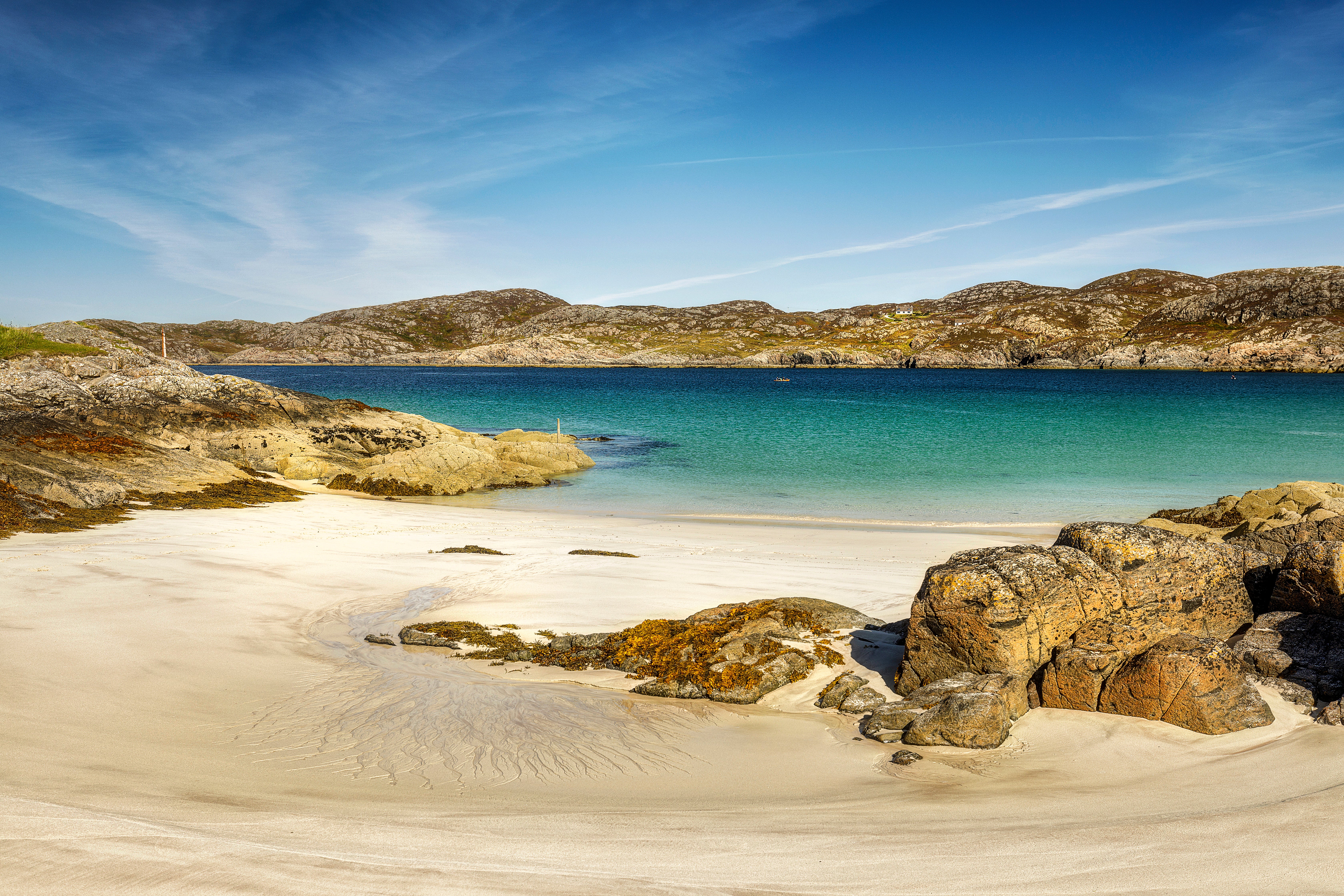 White sand and turquoise water form Achmelvich Bay