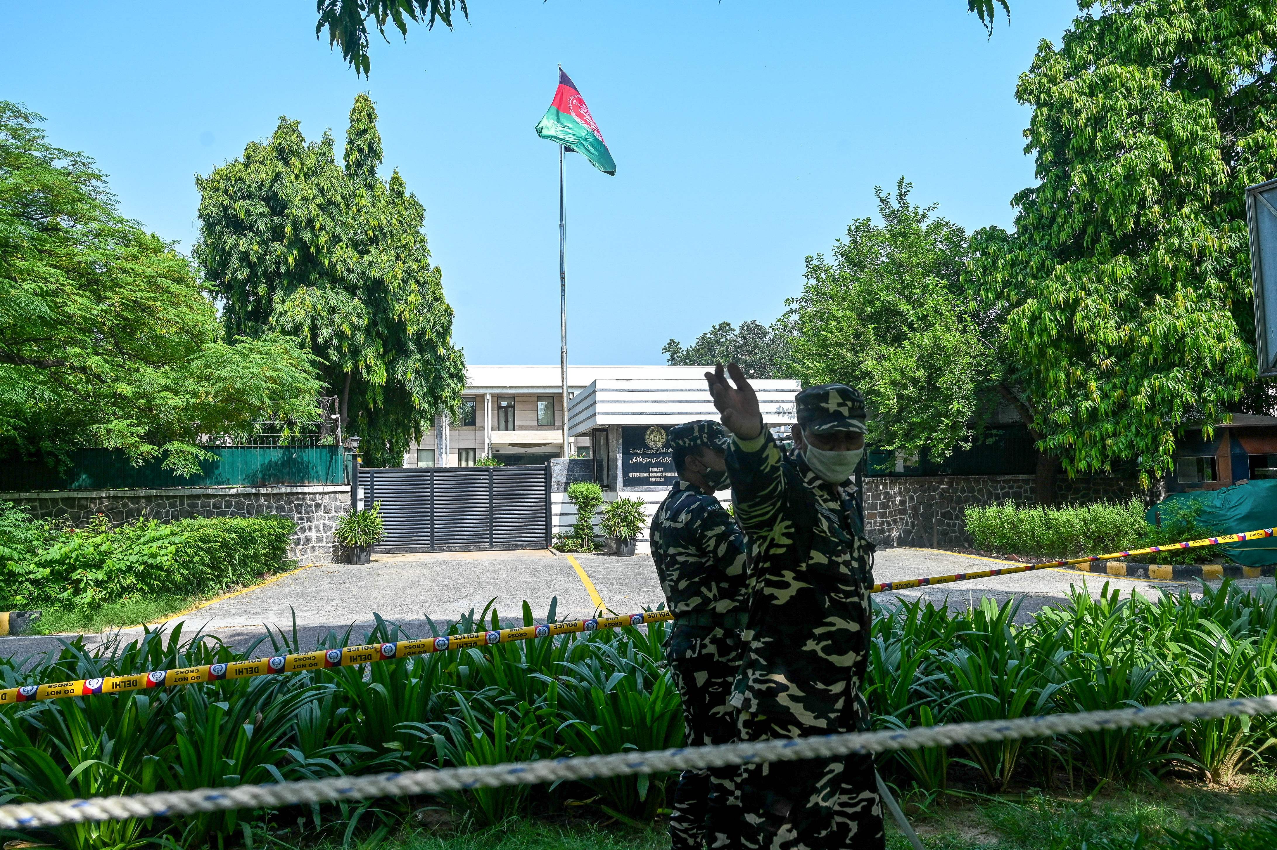 Security personnel stand guard outside the Afghan embassy in New Delhi after the Taliban’s military takeover in August 2021