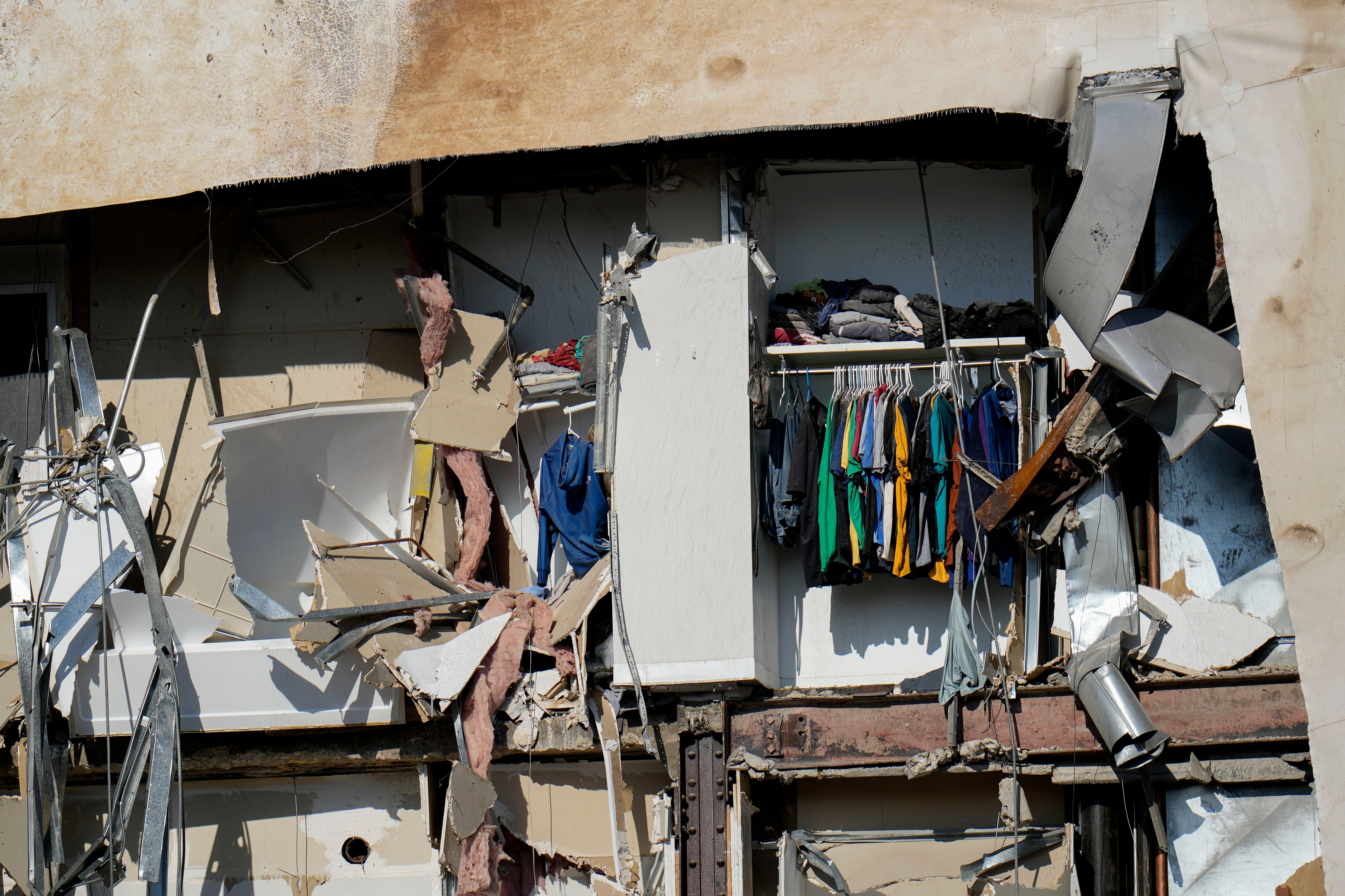 Clothing hanging in an apartment building that partially collapsed