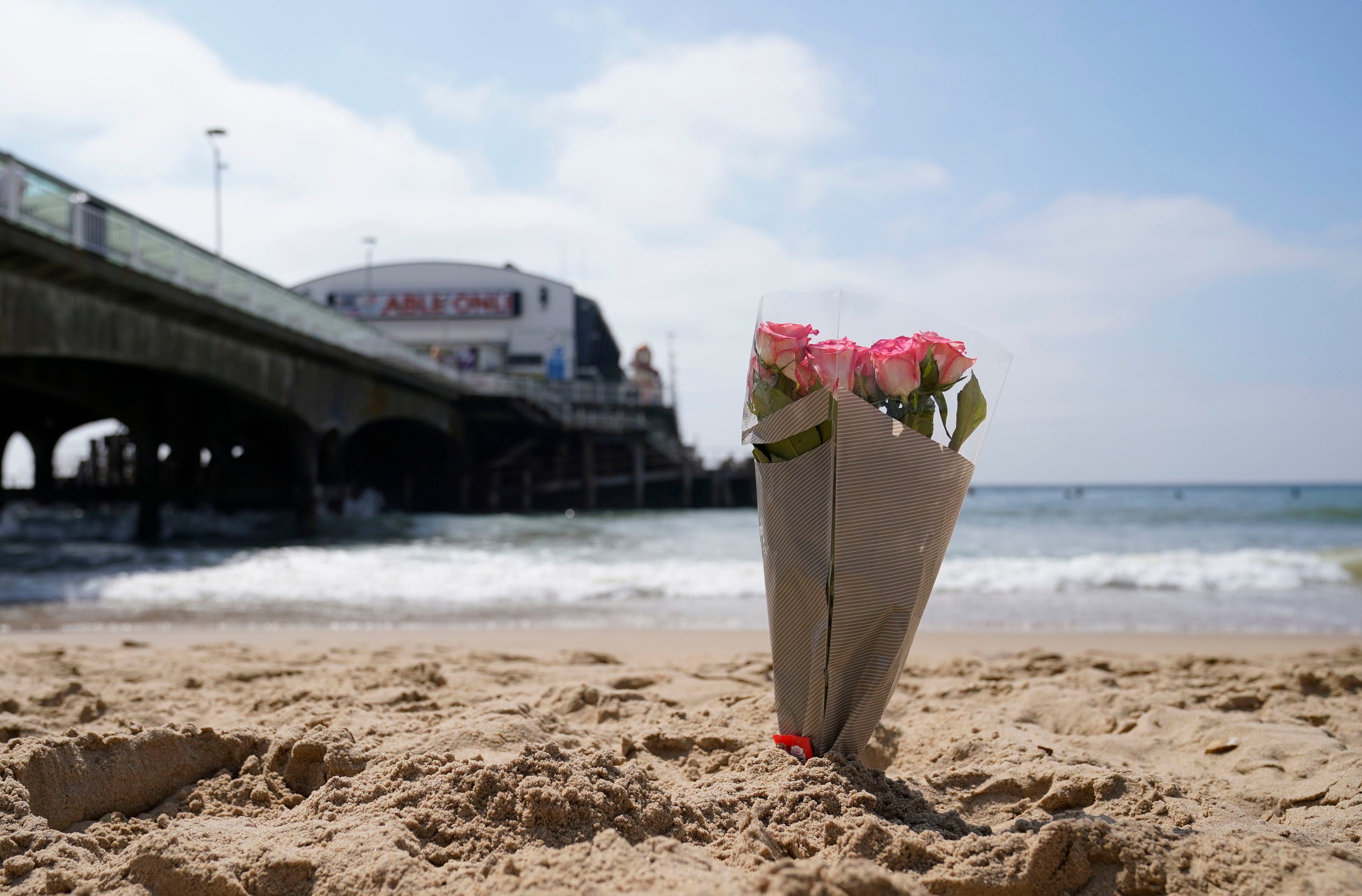 Flowers left at the beach in tribute