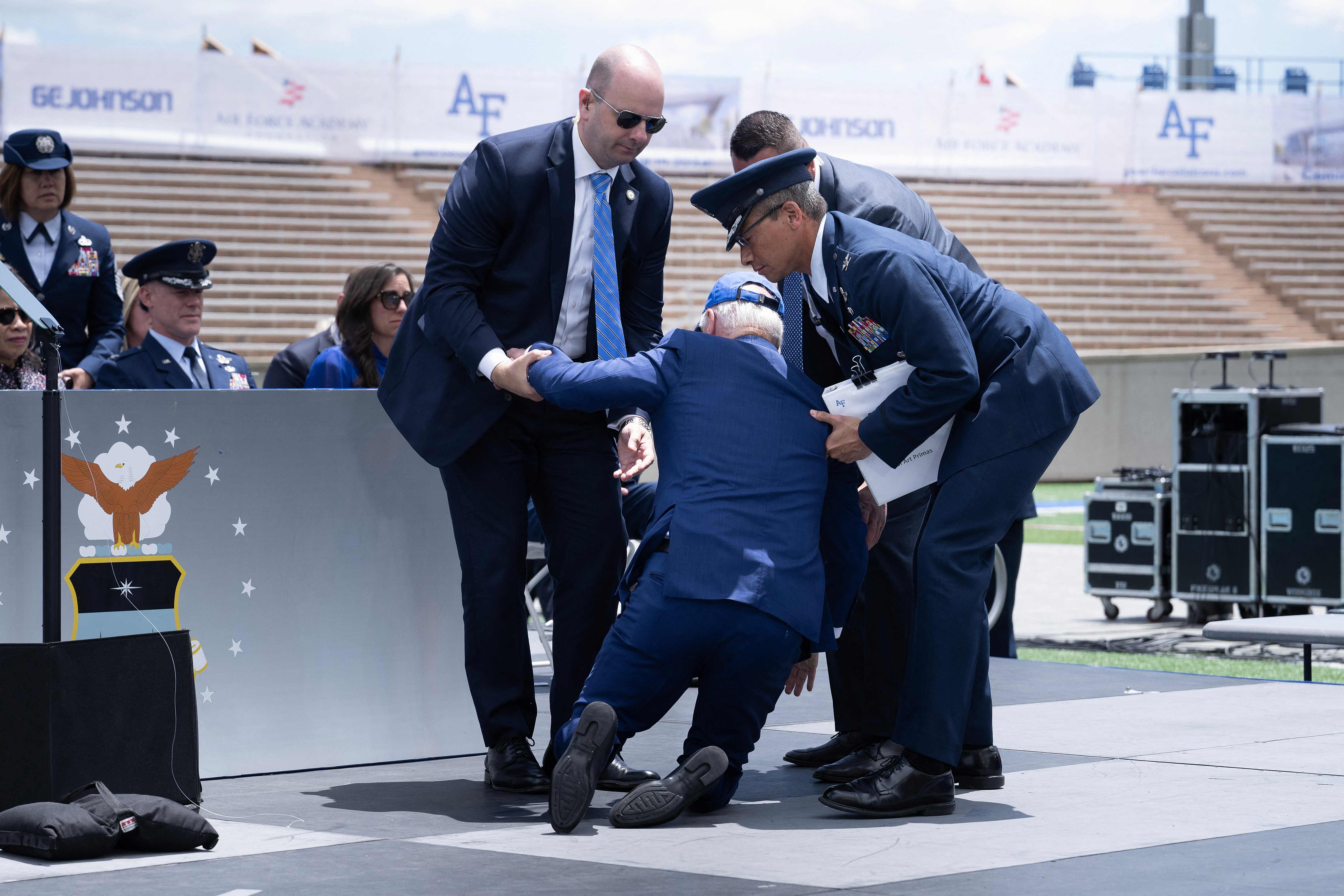 President Biden is helped up