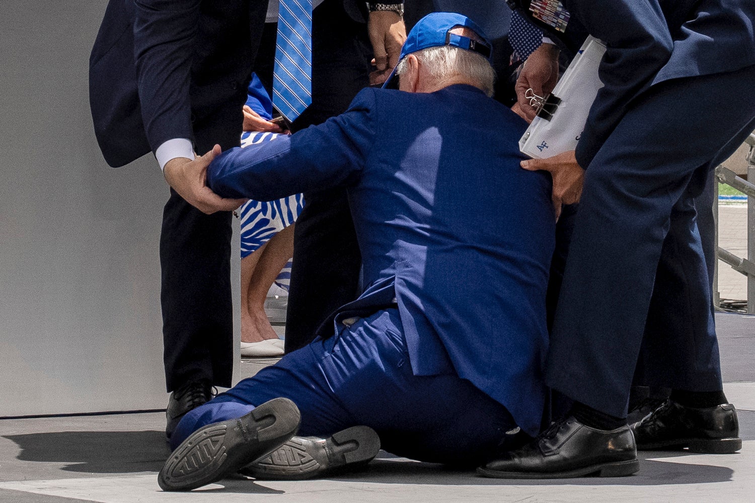 President Joe Biden falls on stage