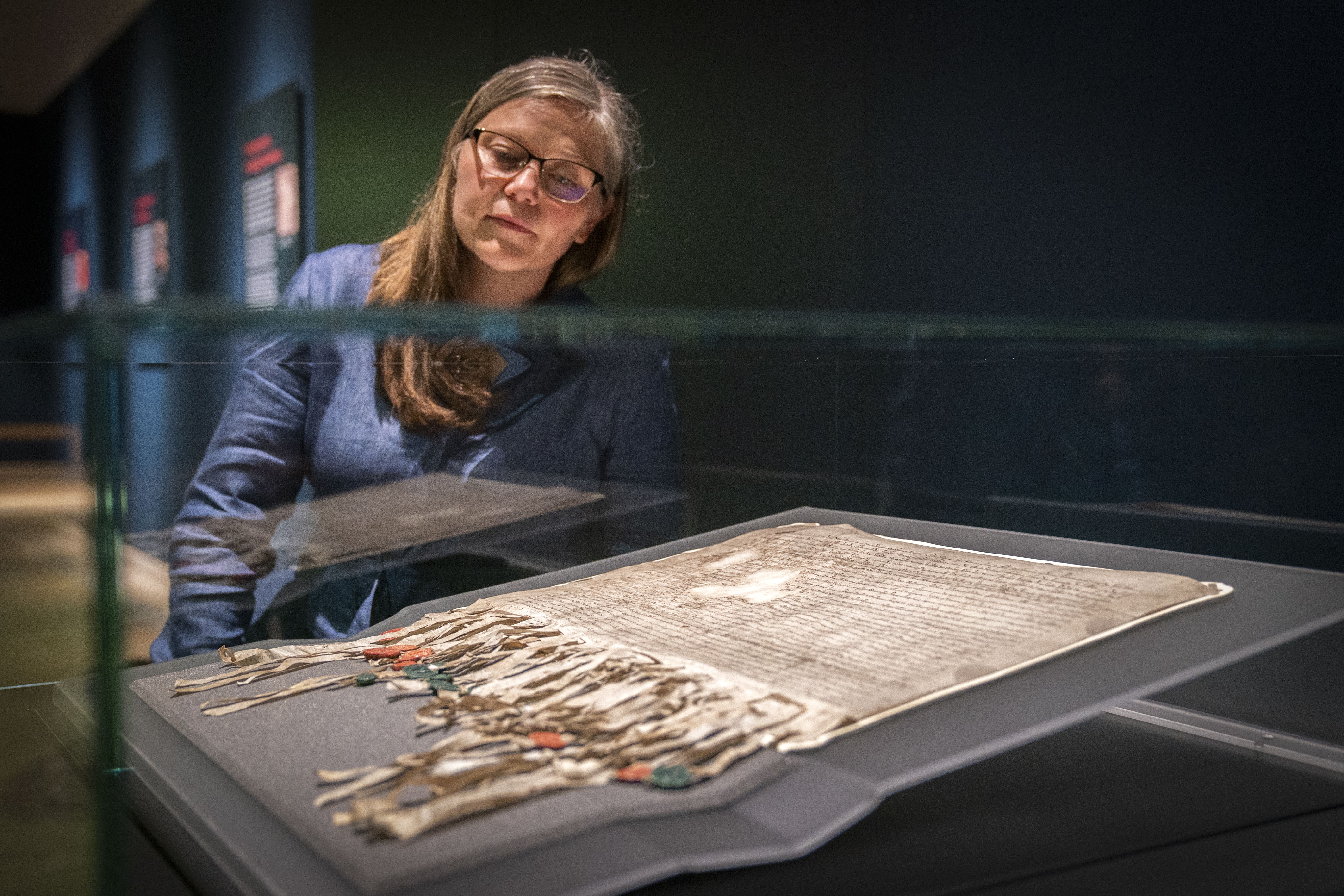 Senior Curator of Medieval Archaeology Alice Blackwell, takes a closer look at The Declaration of Arbroath (Jane Barlow/PA)