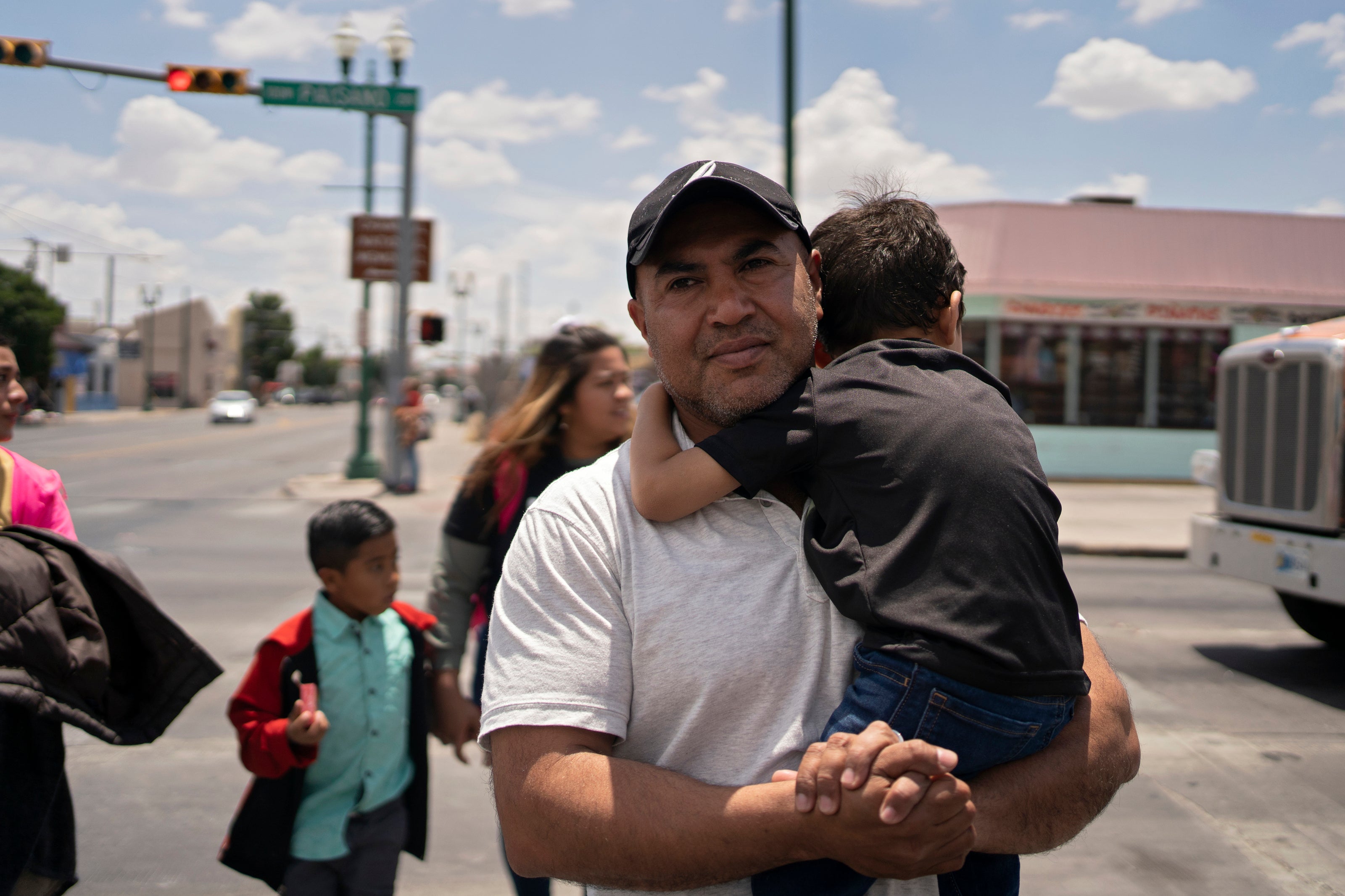 Gerber Callejas carries his son in downtown El Paso