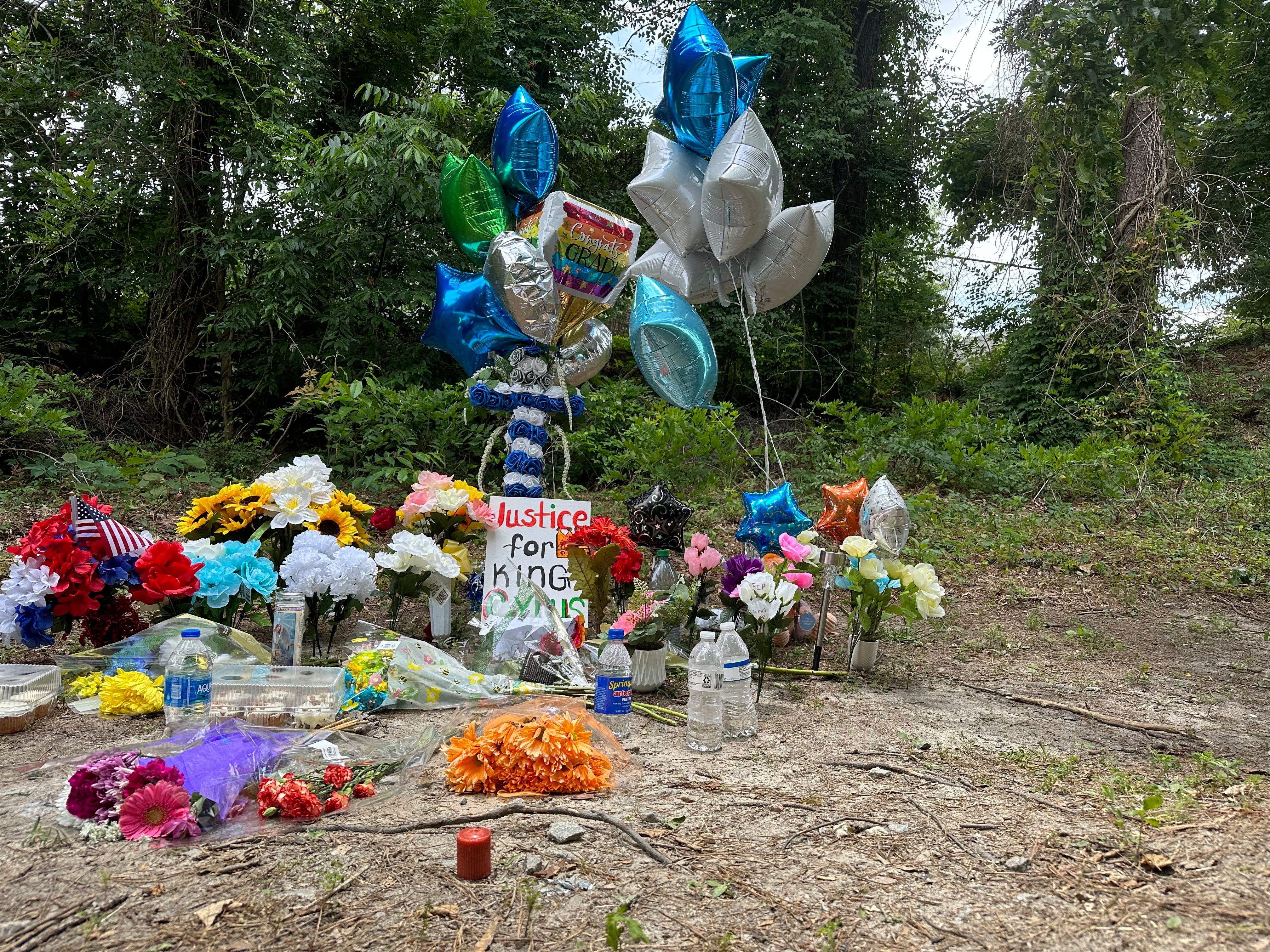 A memorial for Cyrus Carmack-Belton at the site where he was shot to death