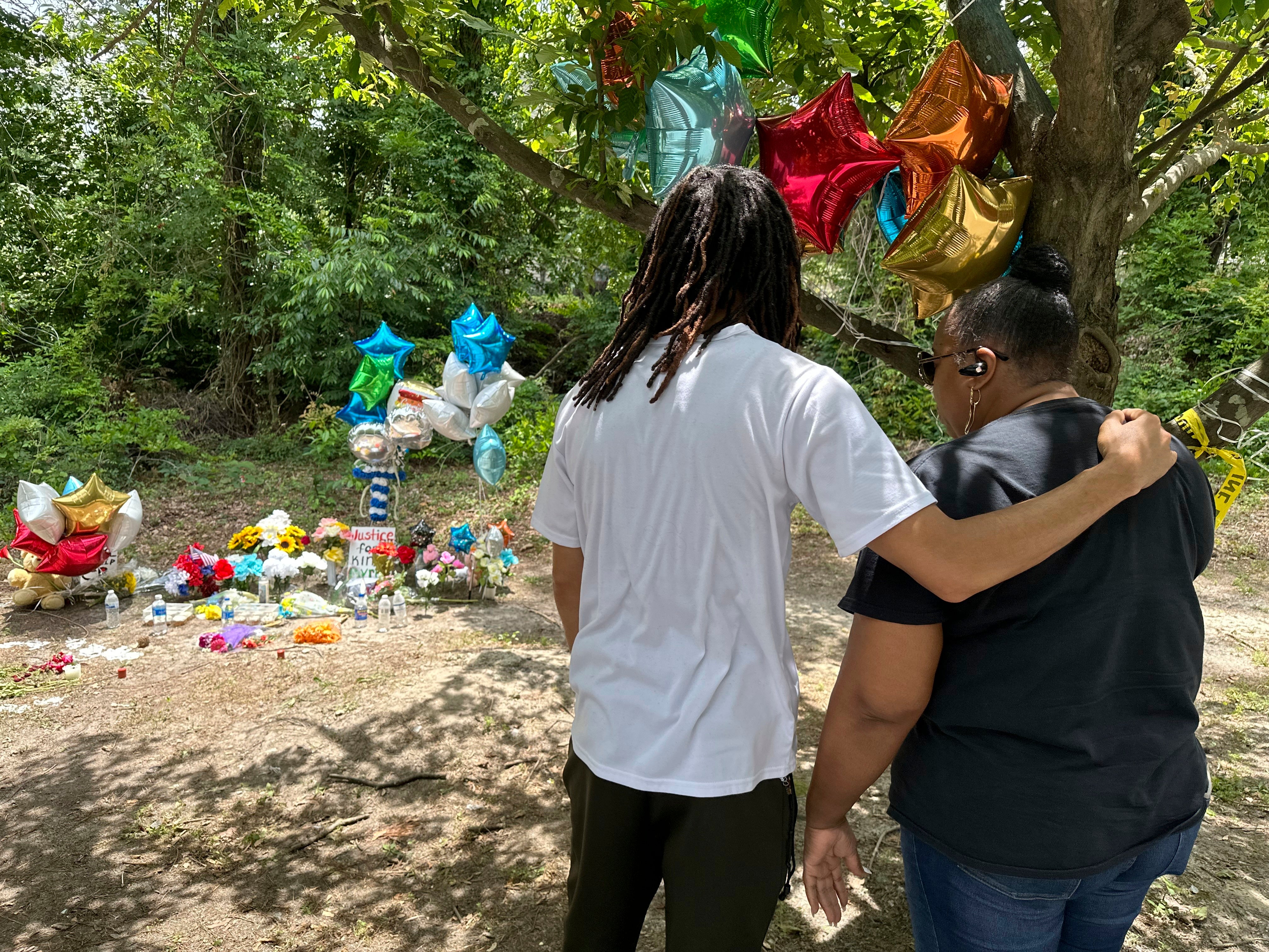 Mourners stop by a memorial to Cyrus Carmack-Belton on Thursday, June 1, 2023, in Columbia,