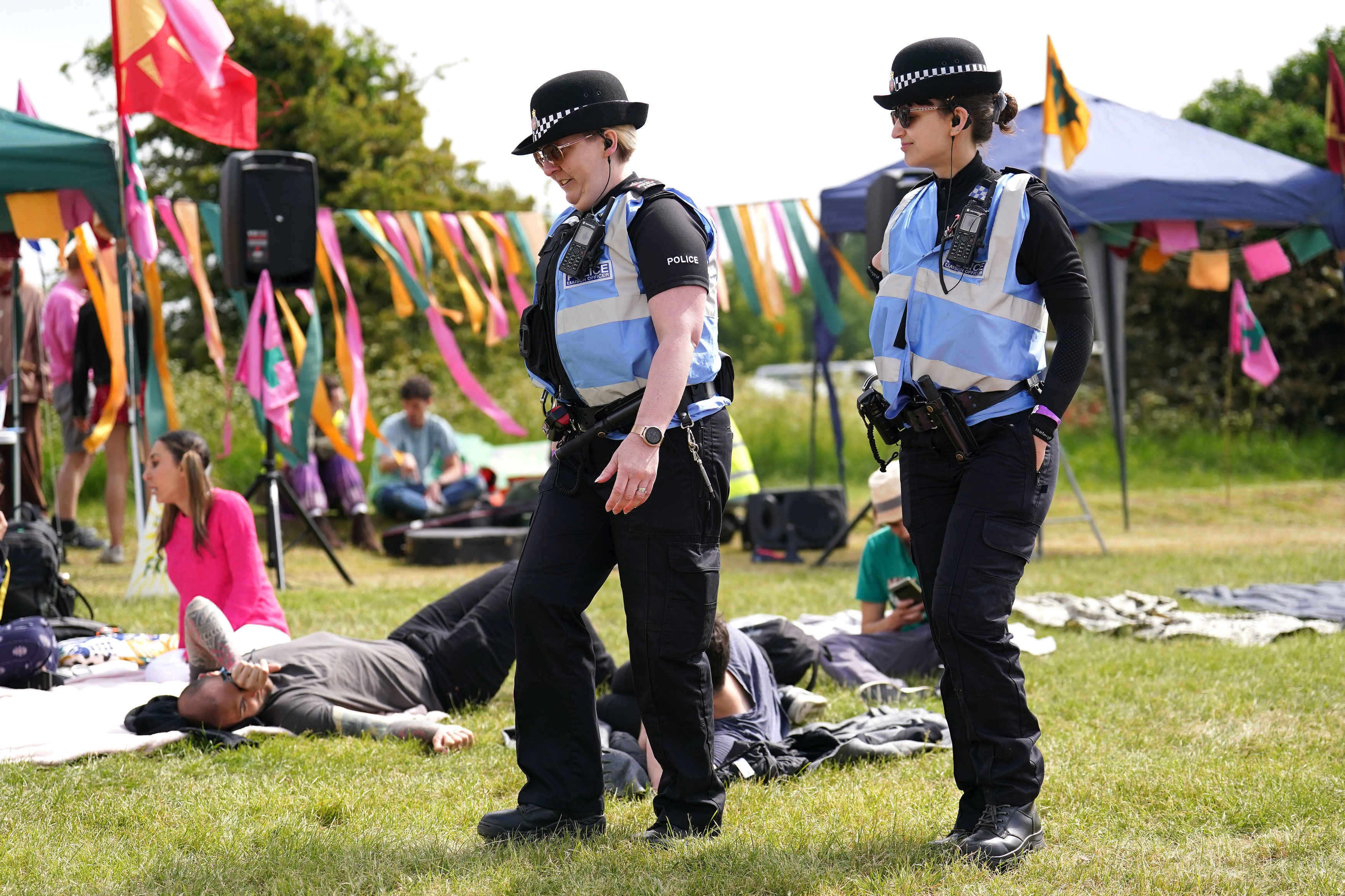 Police Liaison Officers at a protest organised by Animal Rising outside the entrance to the race course ahead of Derby Day