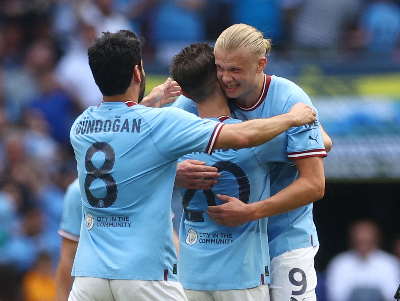 Erling Haaland, Bernardo Silva and Ilkay Gundogan celebrate after the win