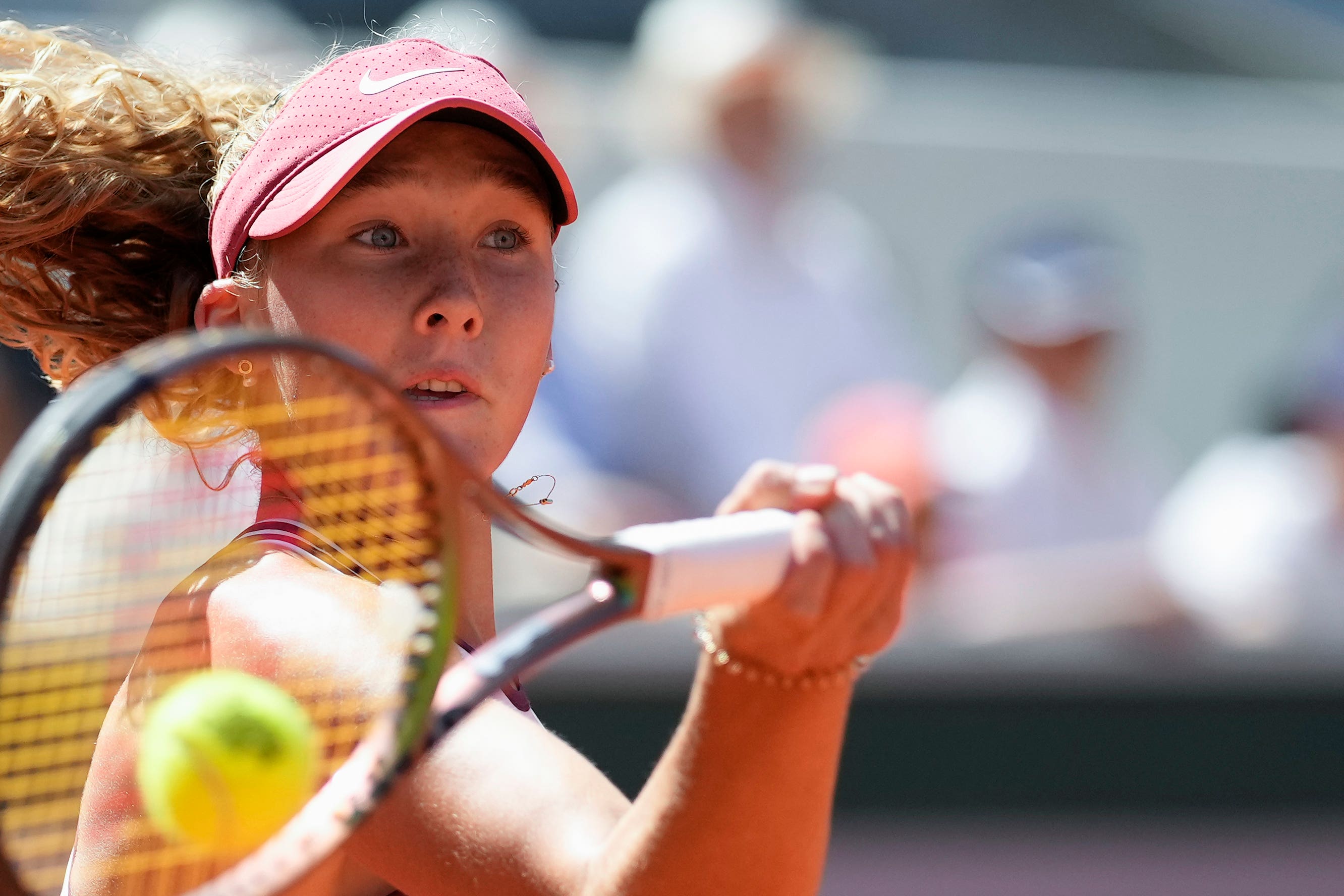 Mirra Andreeva plays a forehand against Coco Gauff (Christophe Ena/AP)