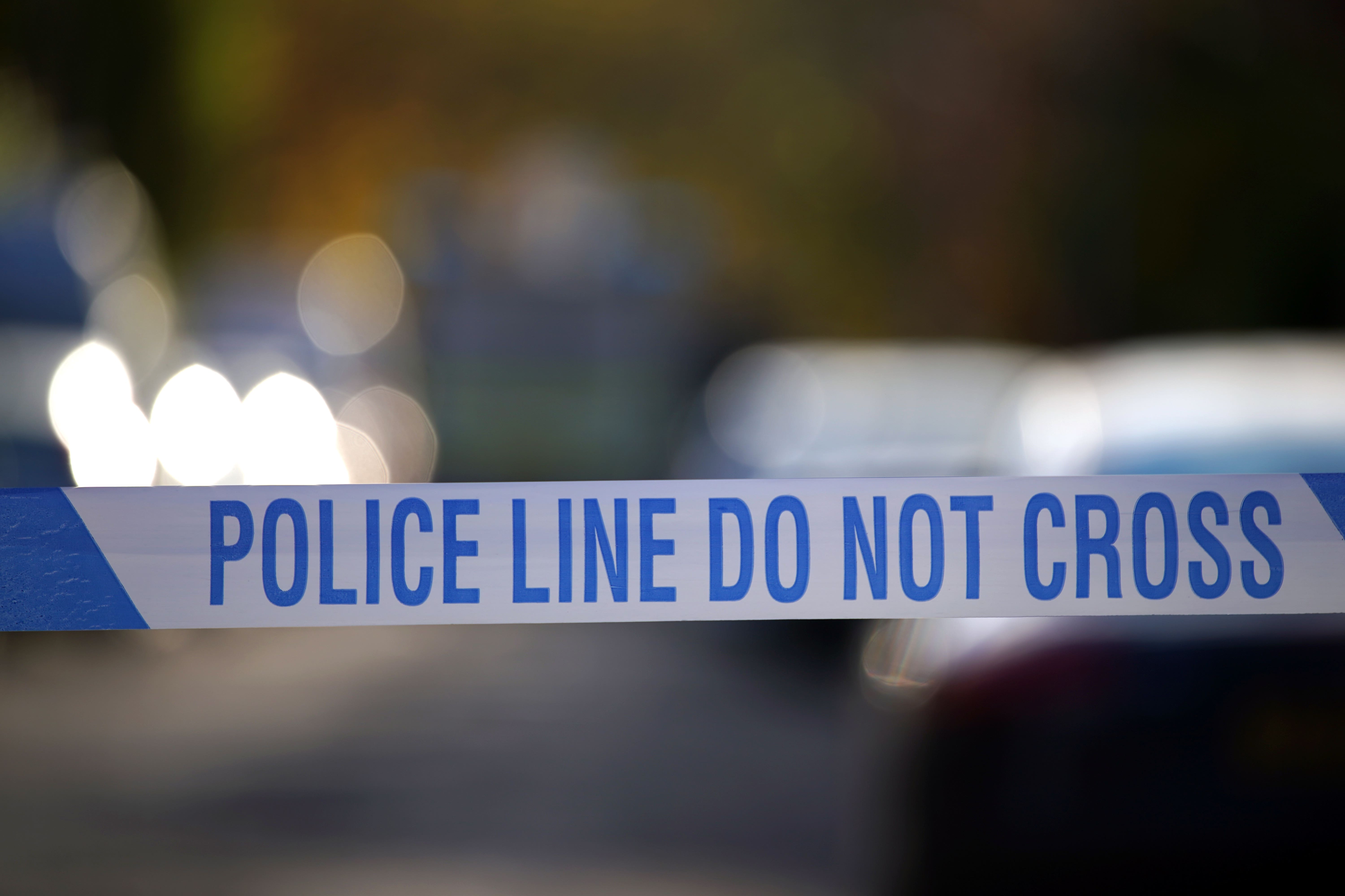 Police tape near a suspected crime scene (Peter Byrne/PA)