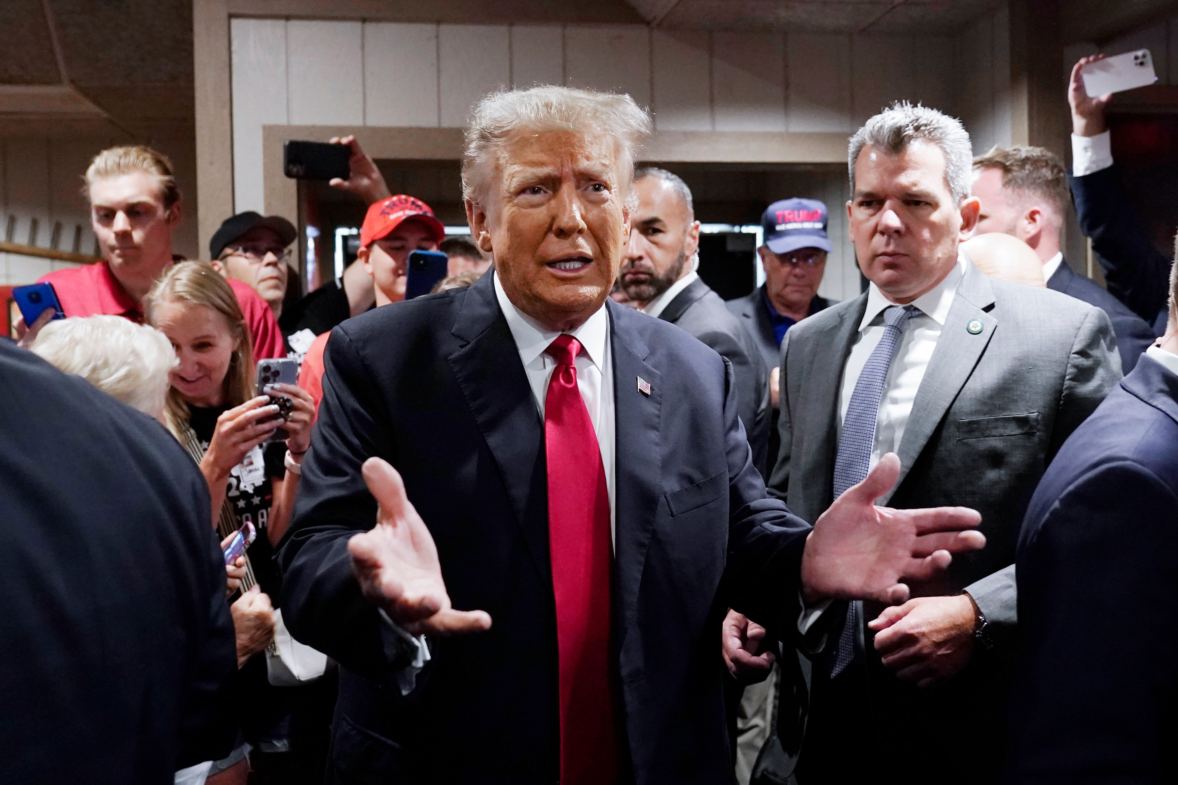 Former President Donald Trump greets supporters before speaking at the Westside Conservative Breakfast, June 1, 2023, in Des Moines, Iowa.