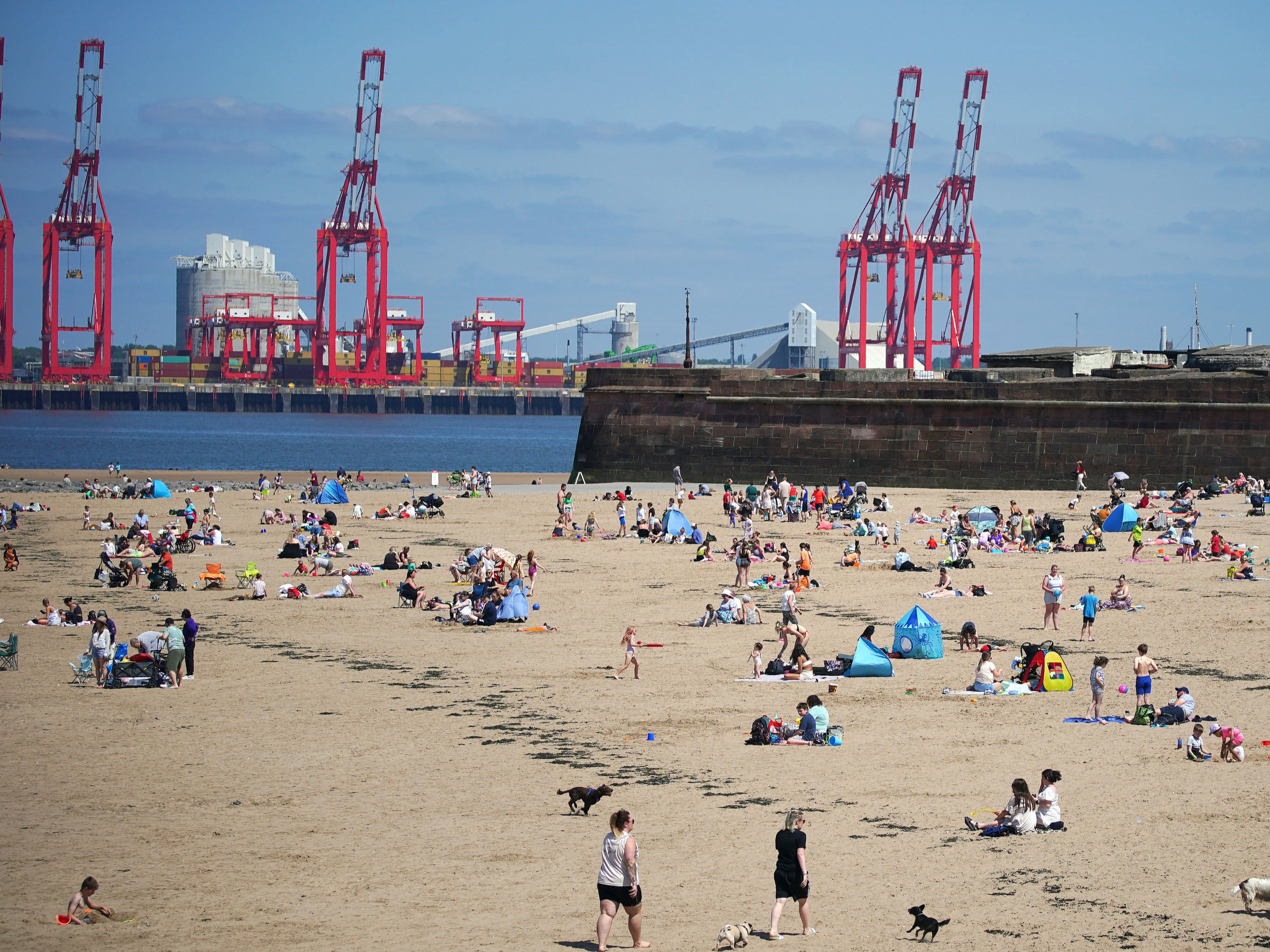 People on the beach at New Brighton on the Wirral, Merseyside