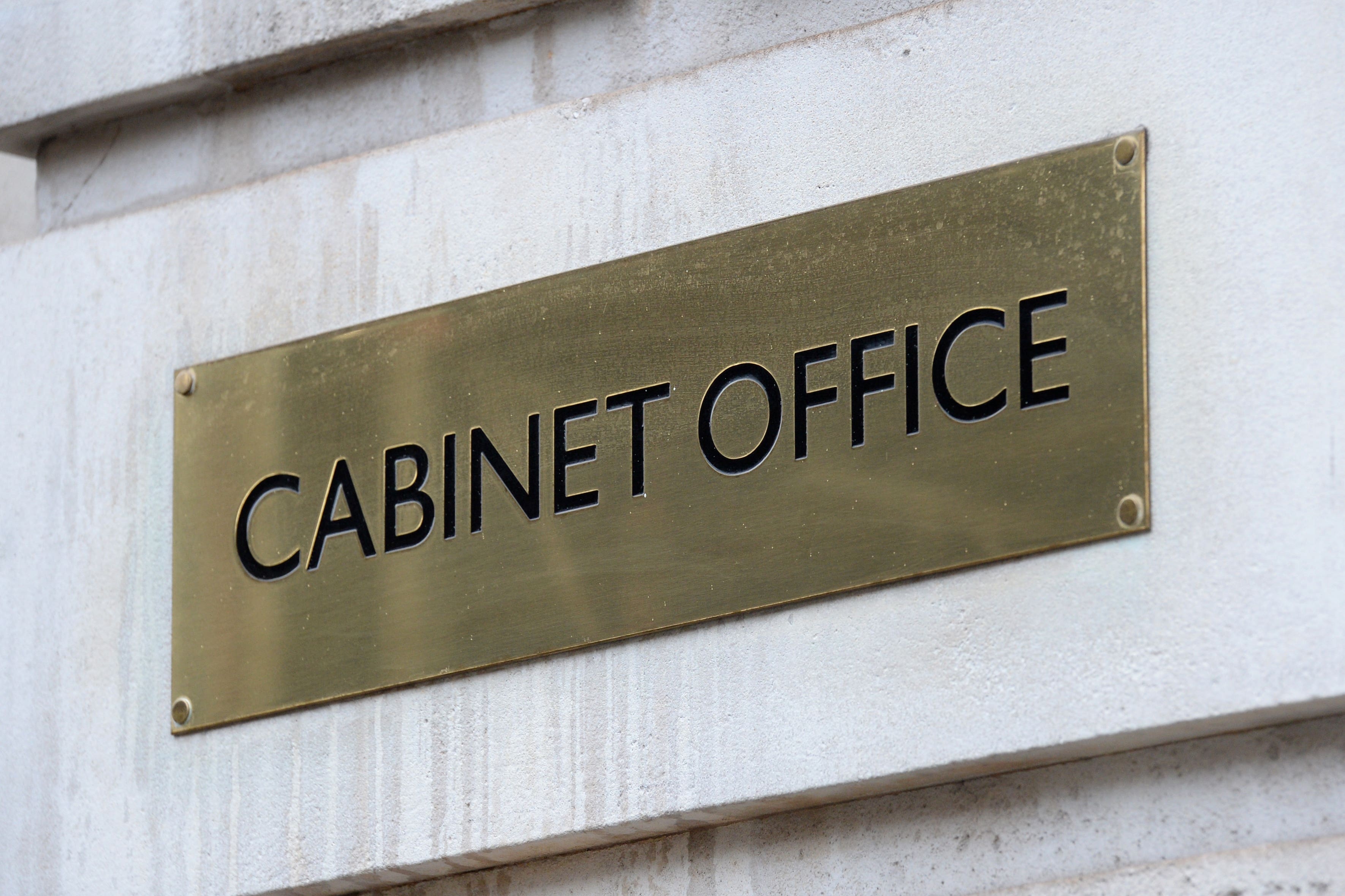 A view of signage for the Cabinet Office in Westminster, London.