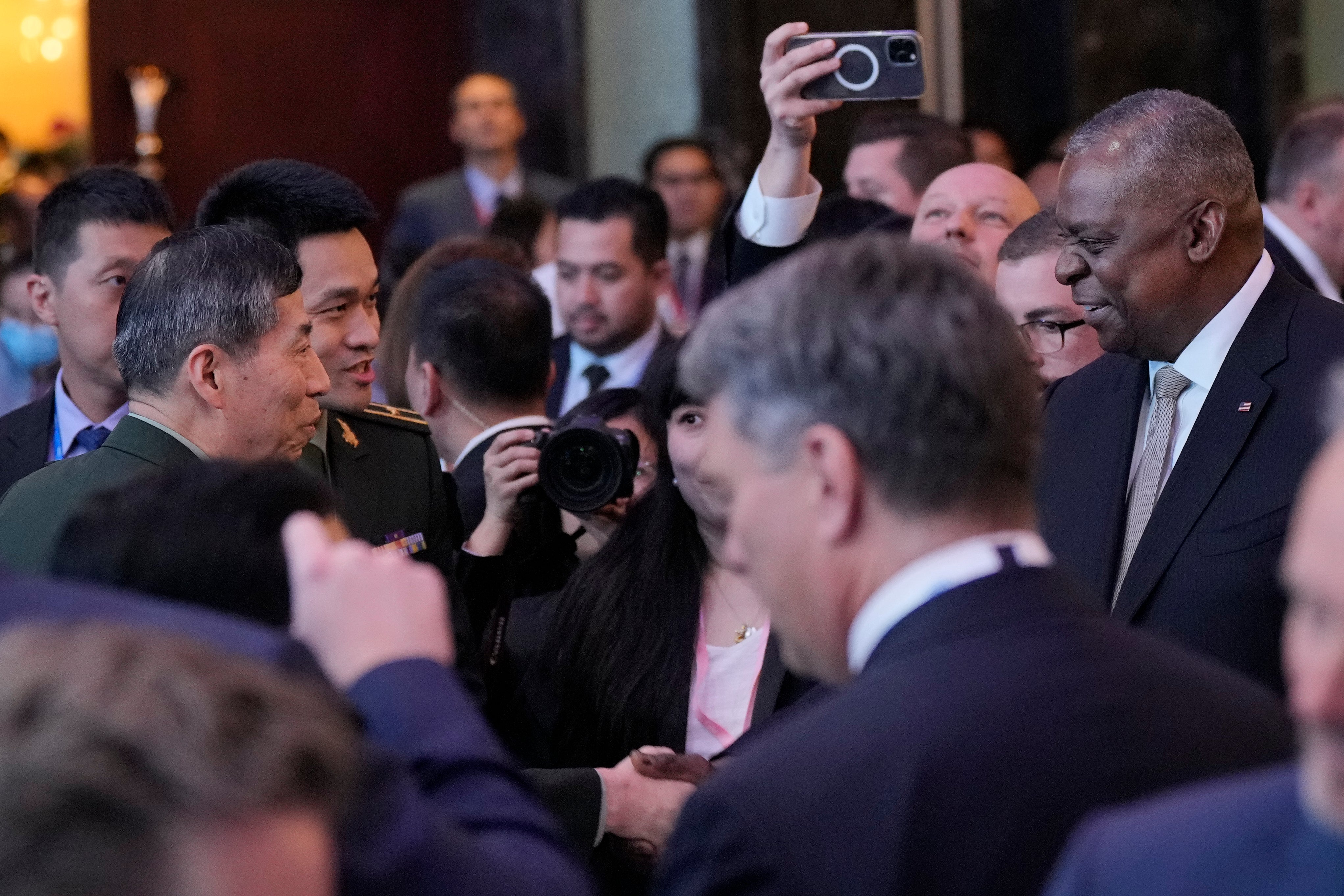 US defence secretary Lloyd Austin (right) shake hands with China defense minister Li Shangfu (left) during the opening dinner during Shangri La Summit