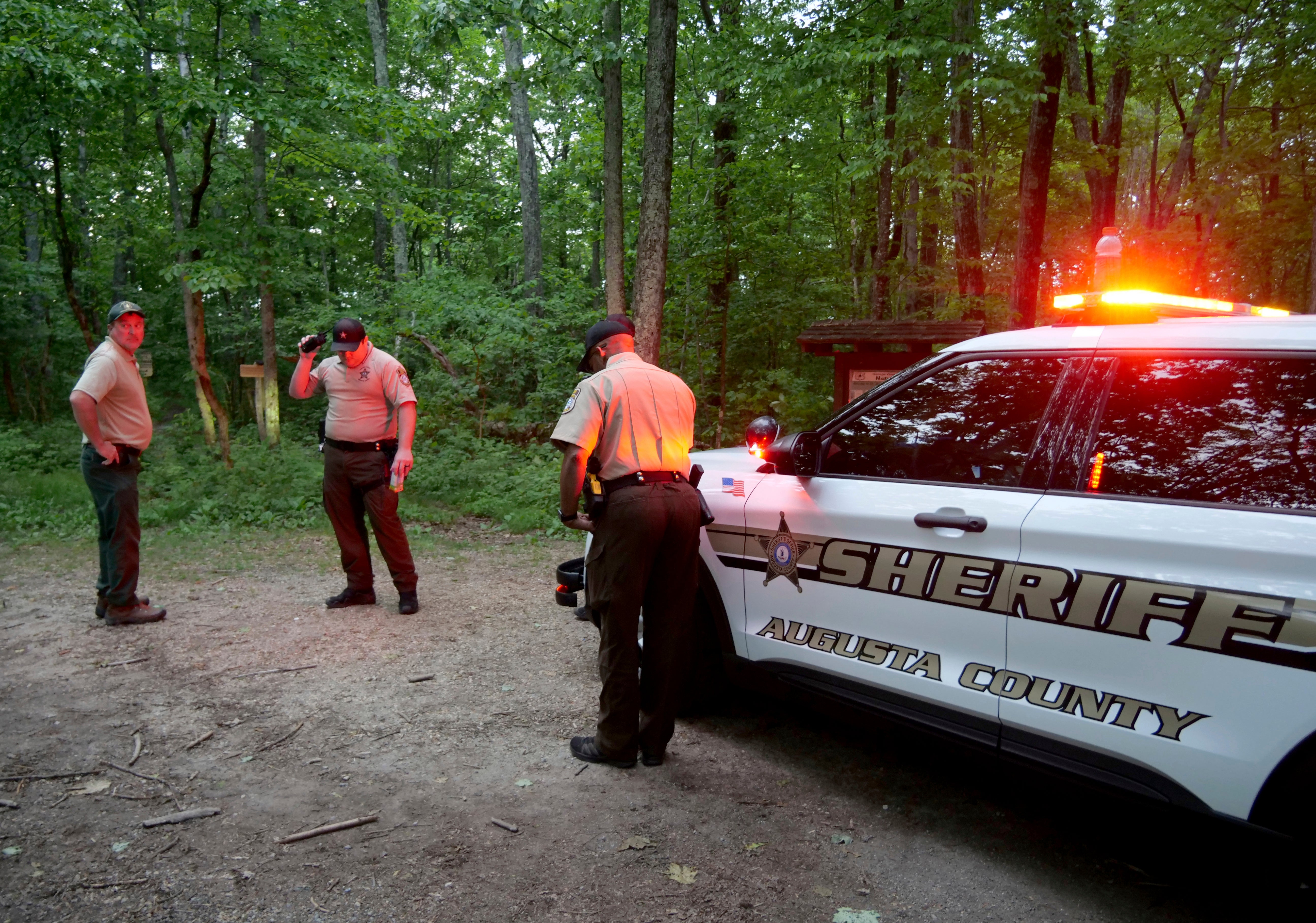 Authorities secure the entrance to Mine Bank Trail, an access point to the rescue operation along the Blue Ridge Parkway where a Cessna Citation crashed over mountainous terrain near Montebello