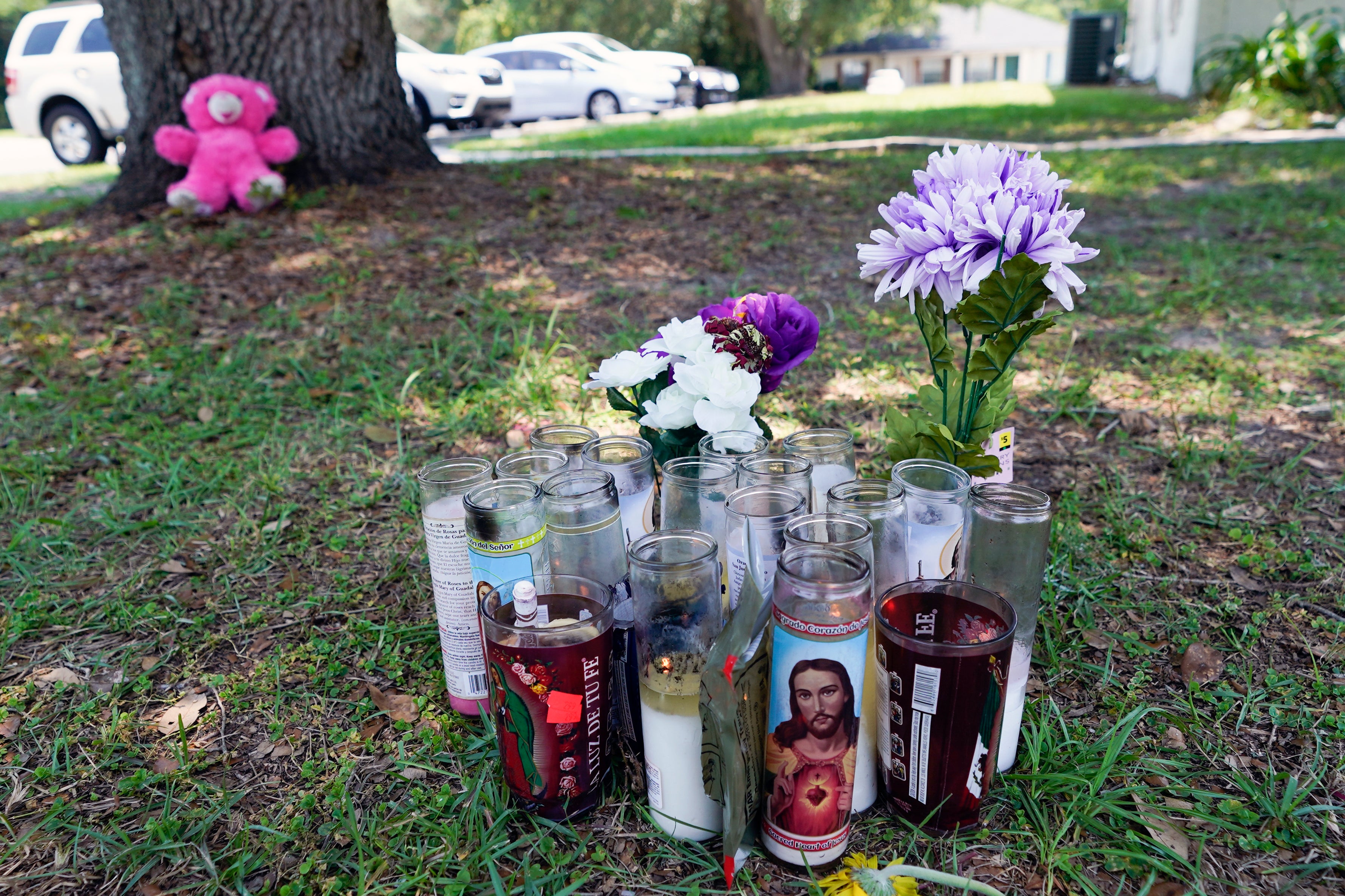 A small memorial is seen outside an apartment, Tuesday, June 6, 2023, in Ocala, Fla., where Ajike Owens was killed