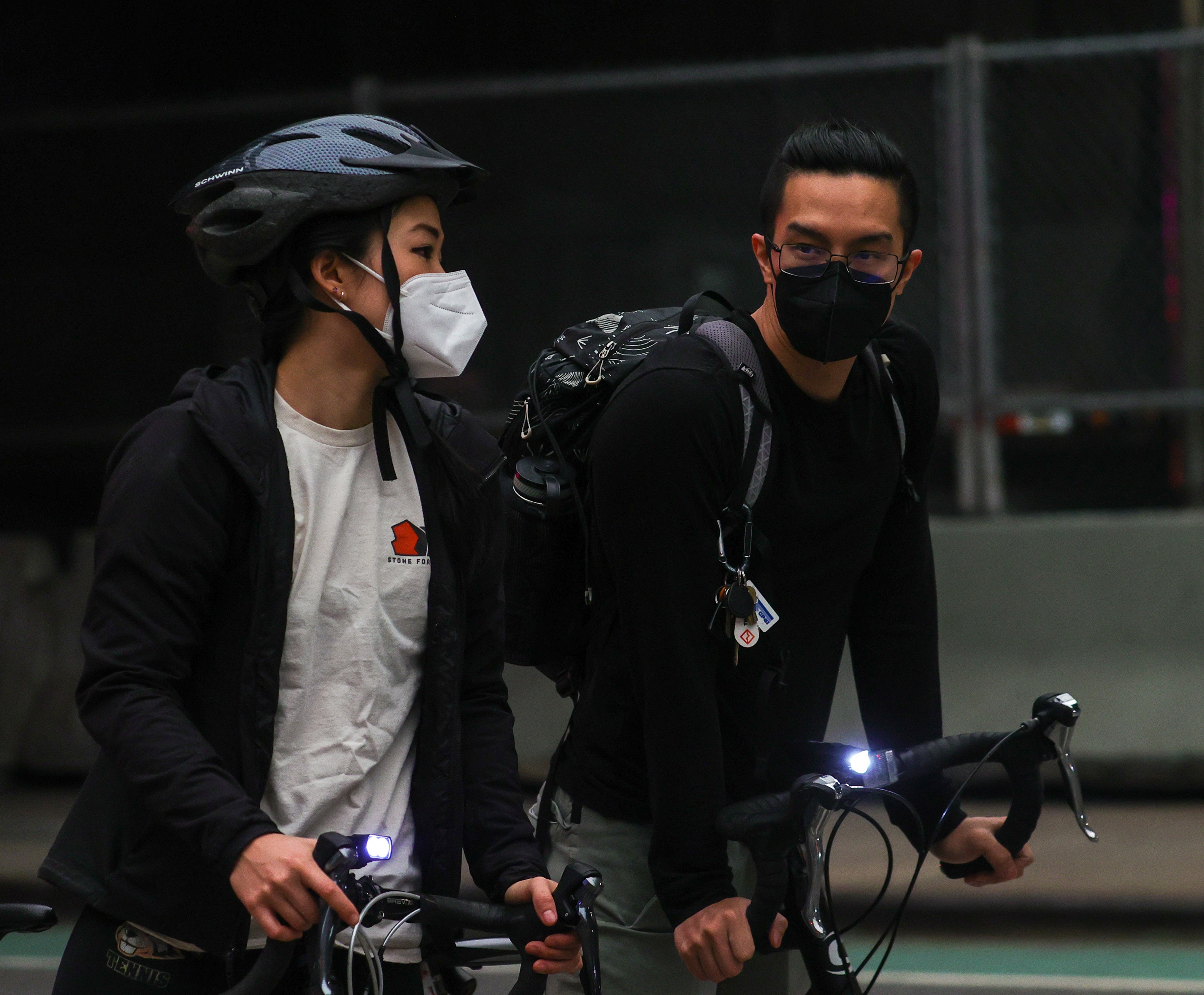 People ride with masks as air quality remains poor in New York City, United States