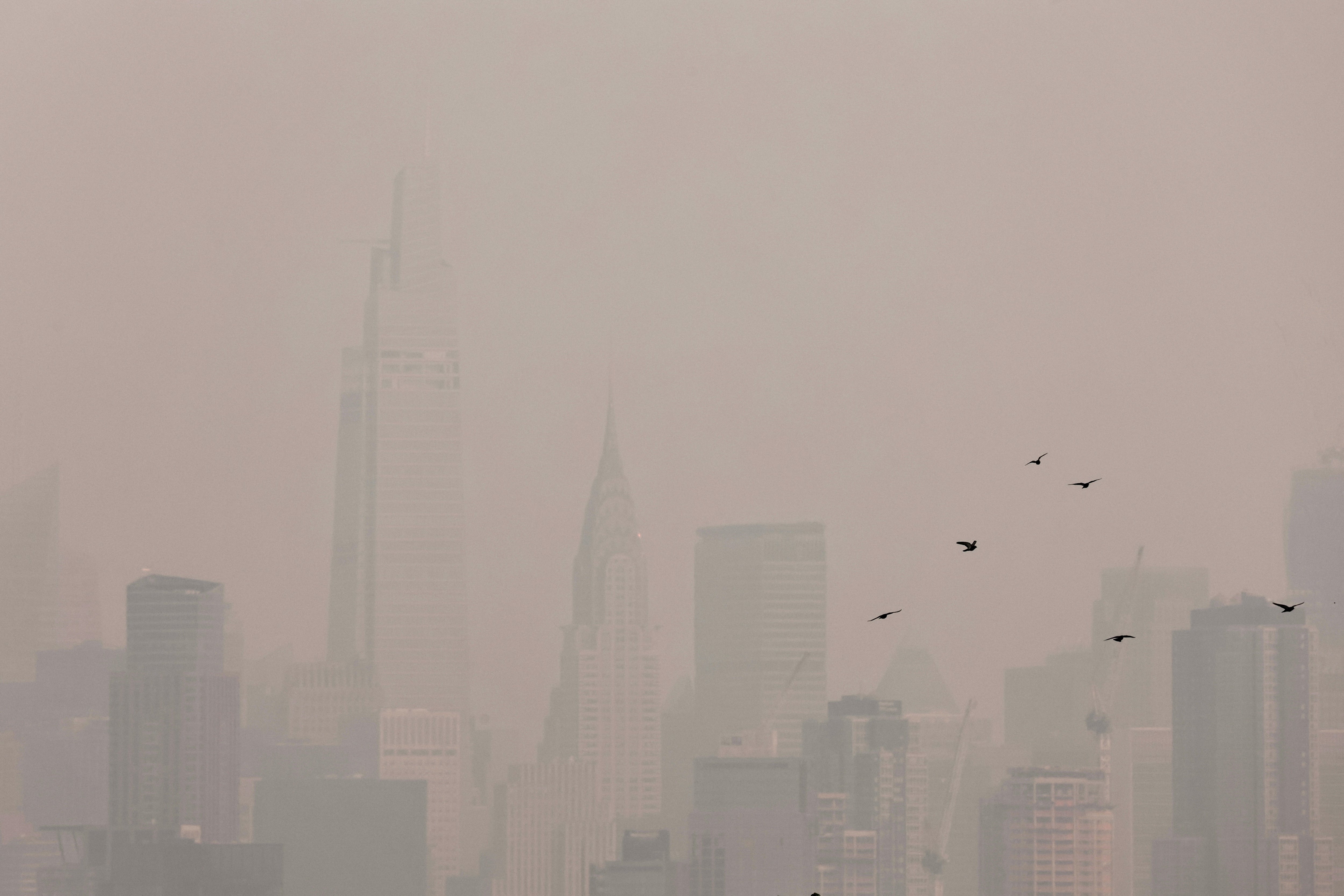 The Manhattan skyline is seen covered in haze and smoke caused by wildfires in Canada on June 7, 2023