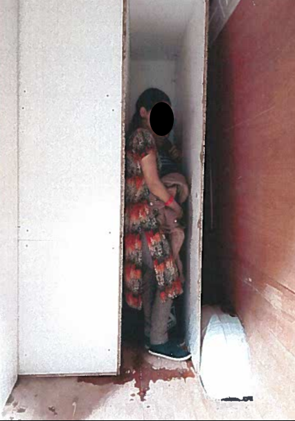 A woman and child in a coffin-like hide