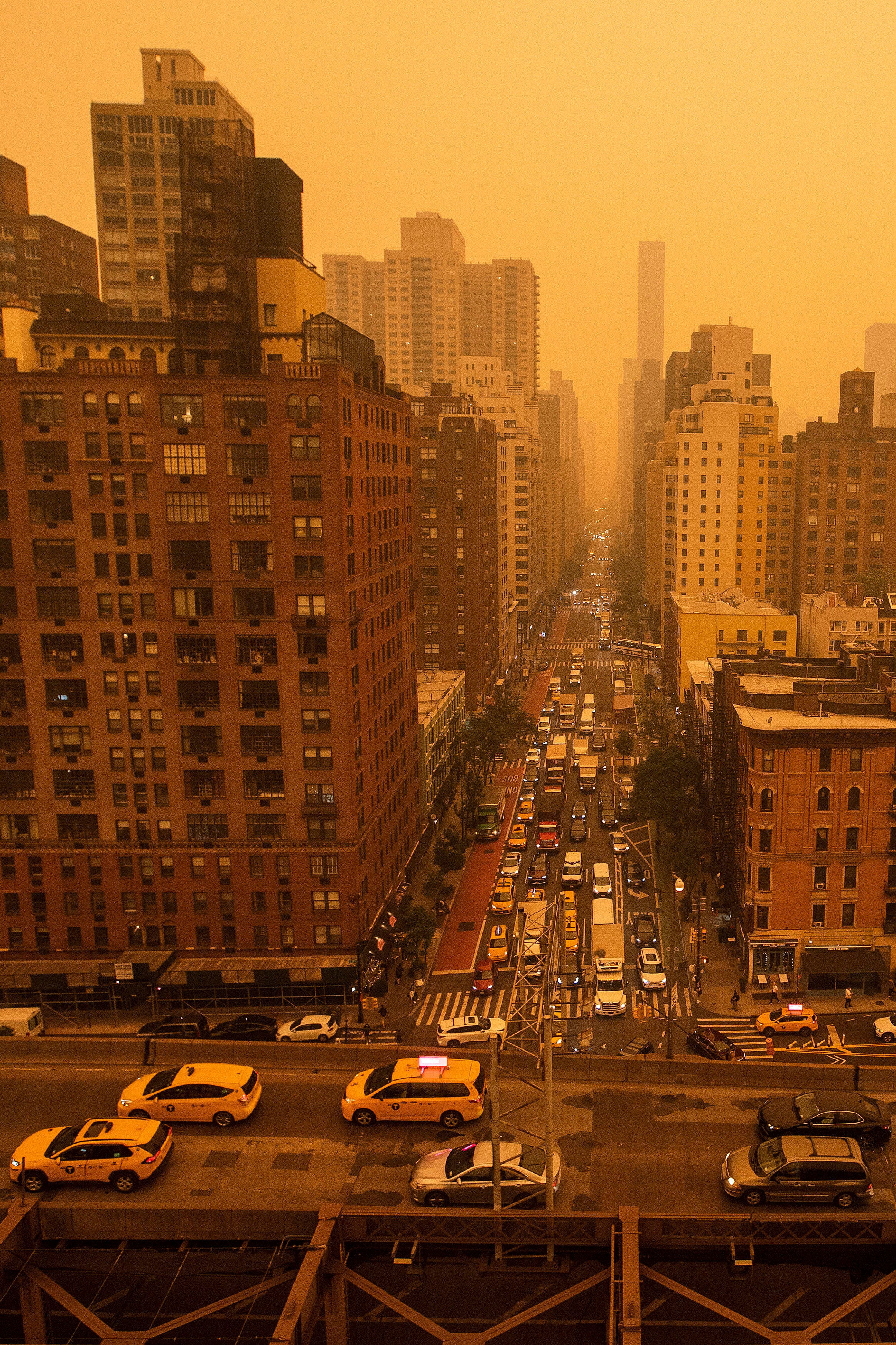 Traffic moves down a city street in Manhattan on Wednesday