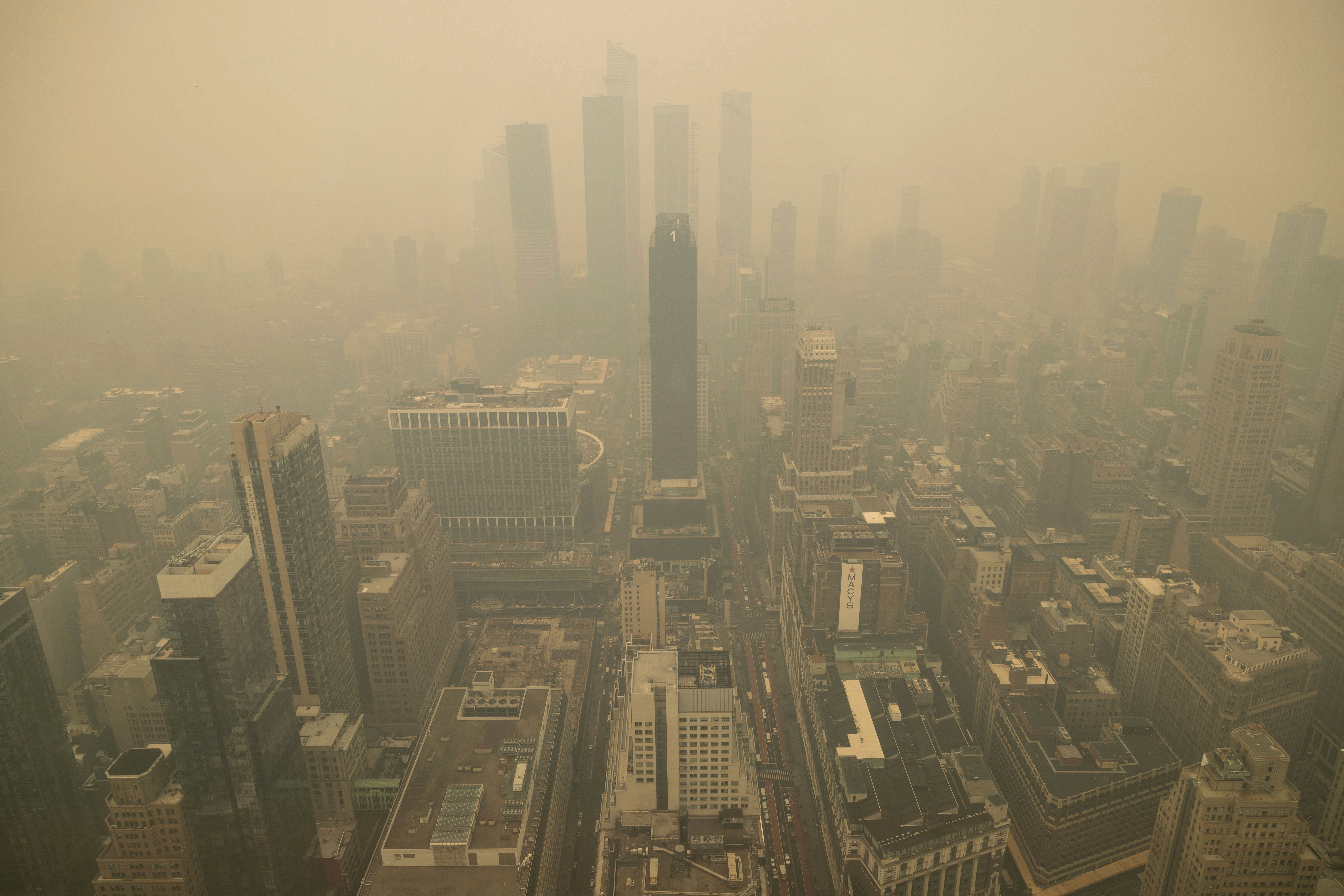 An aerial view shows New York City in a haze-filled sky from the Empire State Building observatory, Wednesday, June. 7, 2023, in New York.