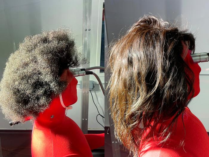 A thermal manikin wearing tightly curled (left) and straight (right) human hair wigs