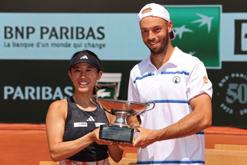 Kato and Puetz celebrate with the mixed doubles trophy