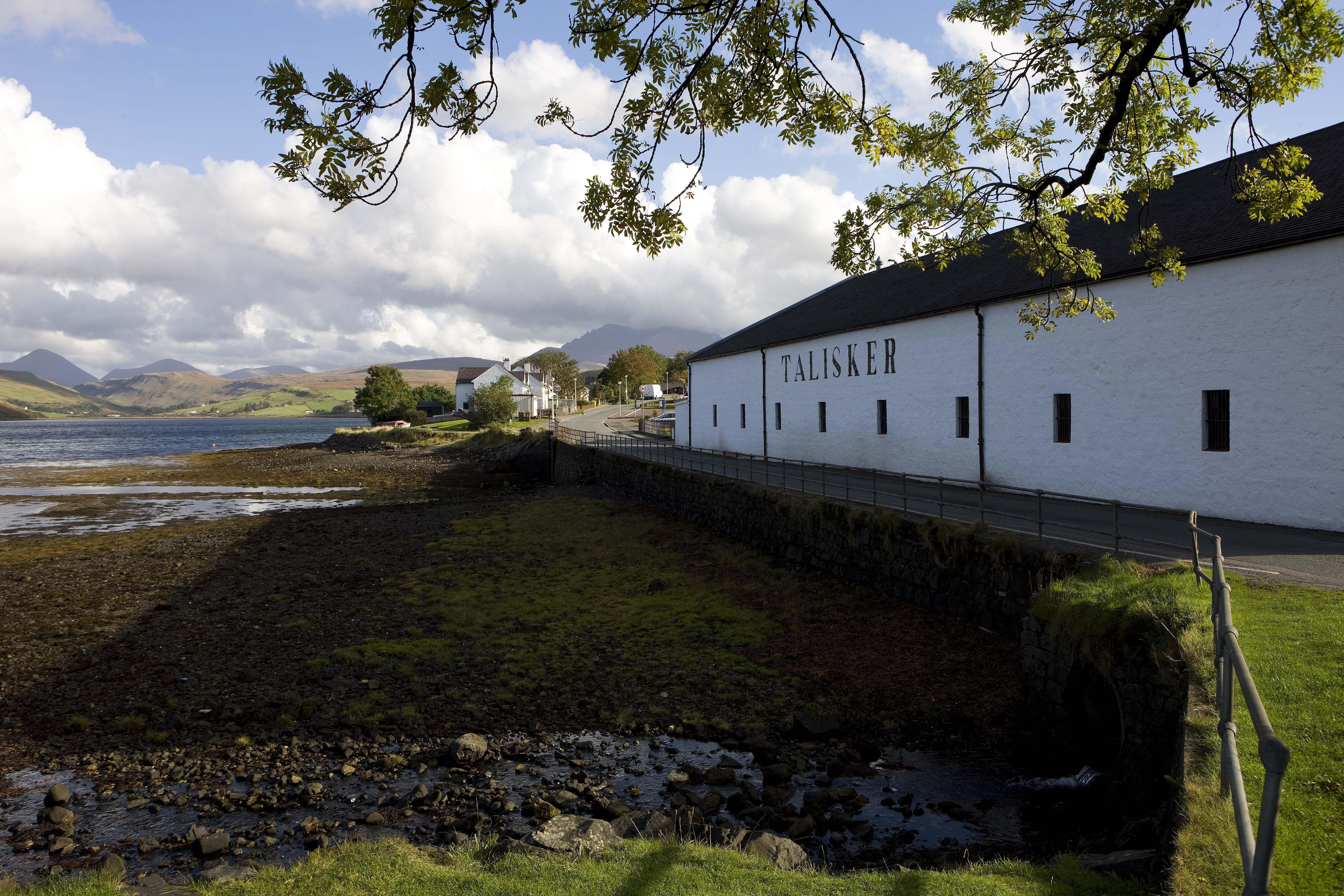 Sir Chris Hoy and endurance swimmer Ross Edgley raced across Loch Harport to the Talisker Distillery to raise awareness of ocean conservation (Diageo/PA)