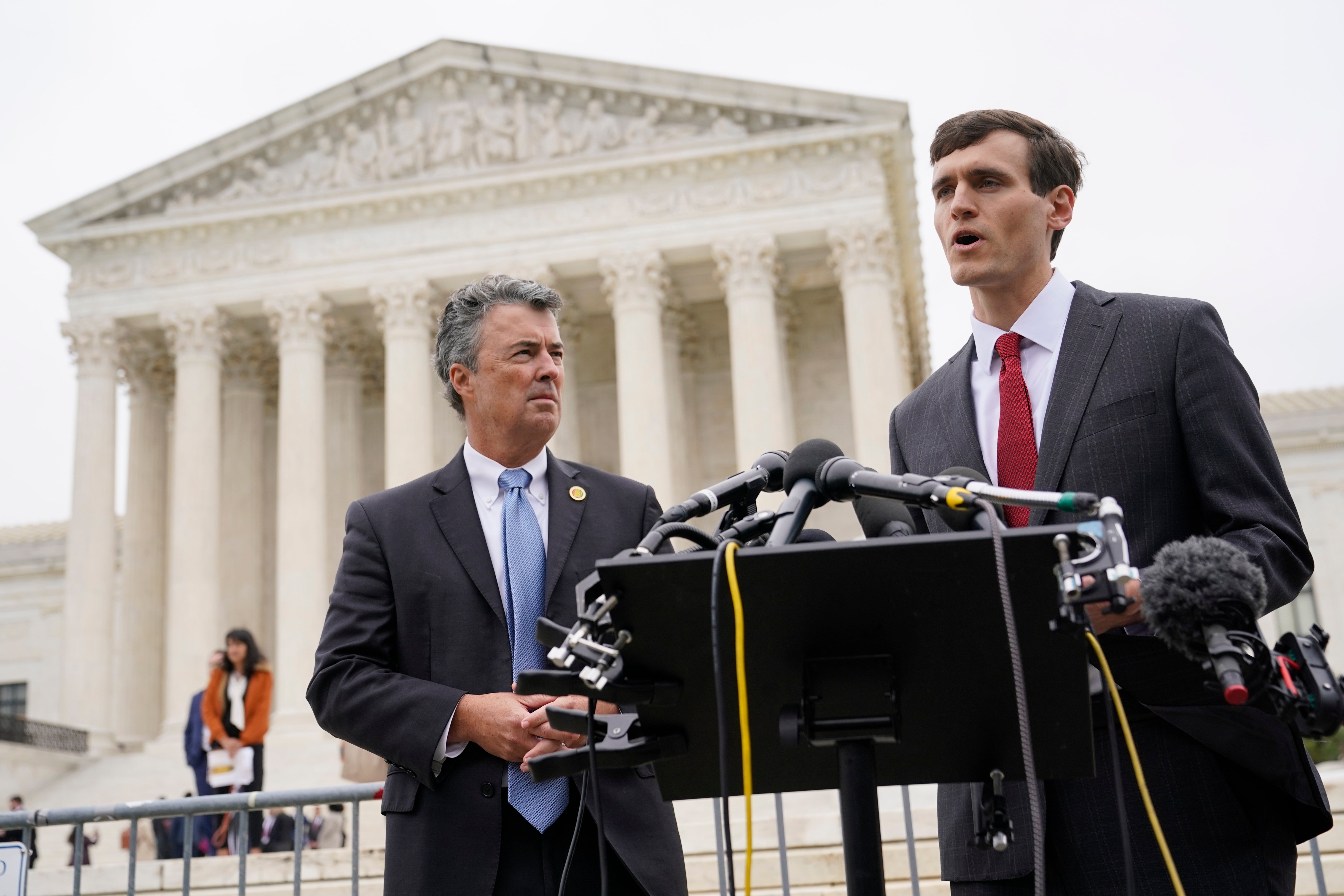 Alabama solictor general Edmund LaCour, right, and attorney general Steve Marshall address reporters after Supreme Court oral arguments in redistricting case last year