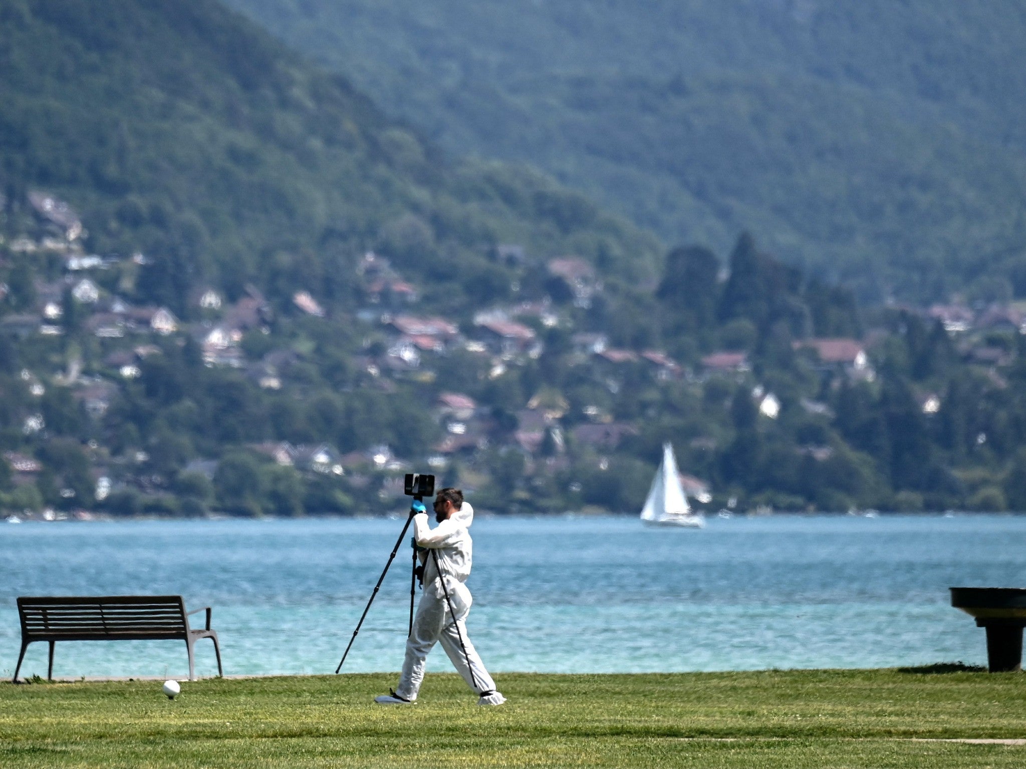 A French forensic police officer during the investigation around the lake