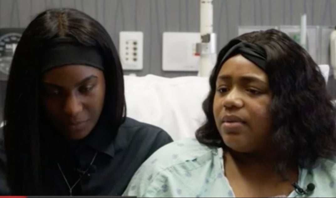 Quanishia ‘Peach’ White Berry (right) lost her leg during her rescue from the rubble at the site of a building collapse in Davenport, Iowa