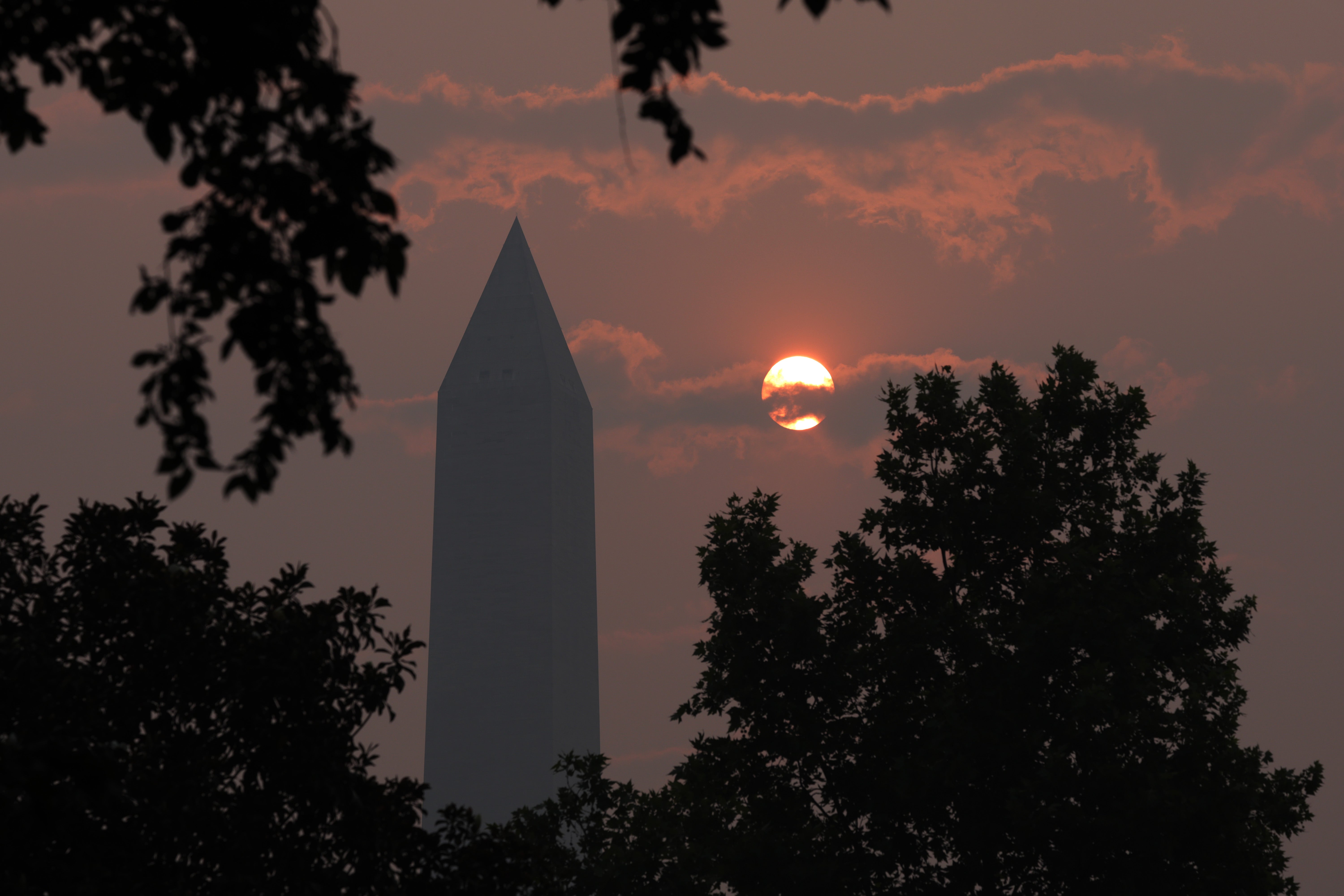 The Washington Memorial stands in hazy smoke on Thursday