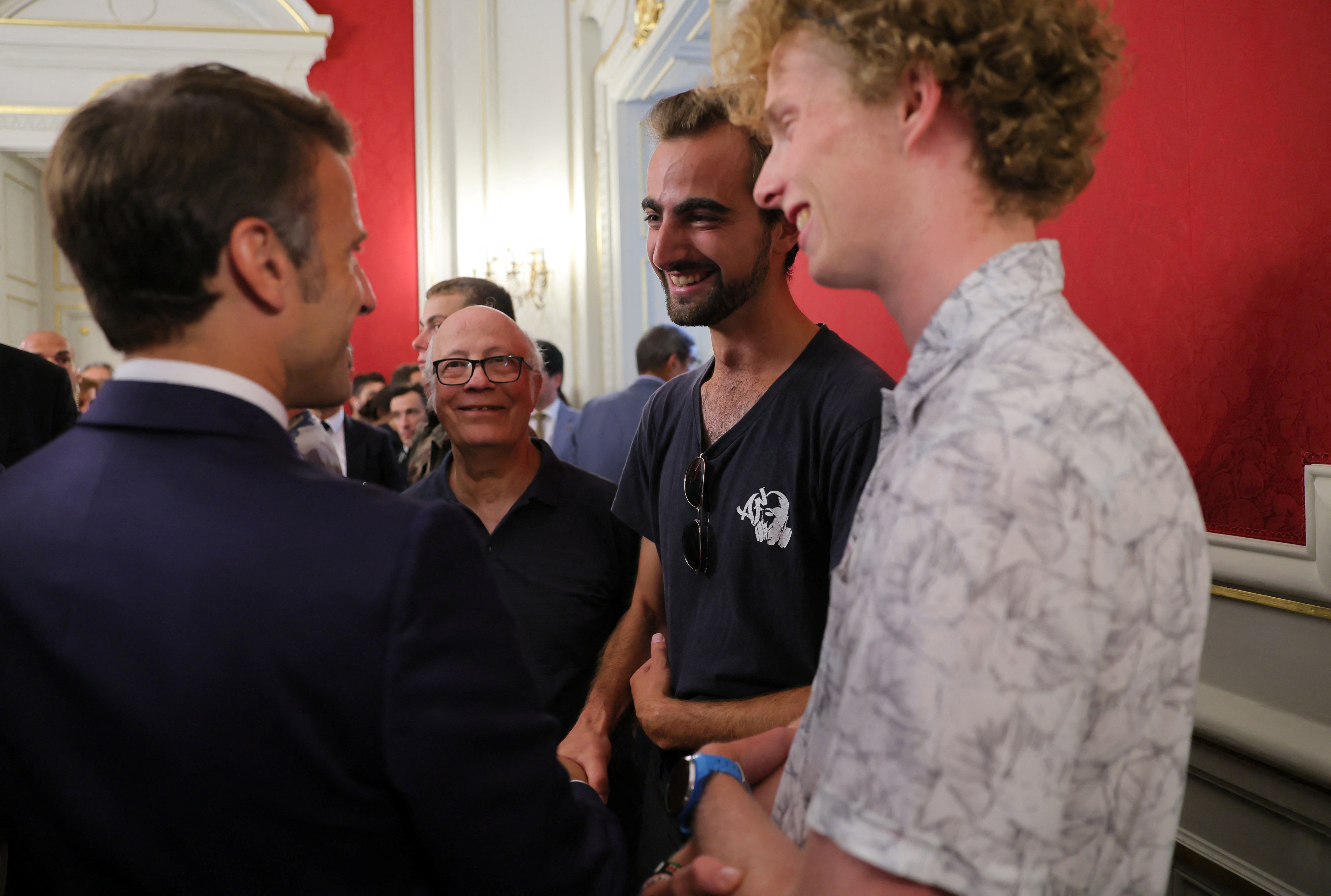 Emmanuel Macron shook hands with Henri, his friend Lilian, and Youssouf, who suffered minor stab wounds as he tried to intercept the suspect