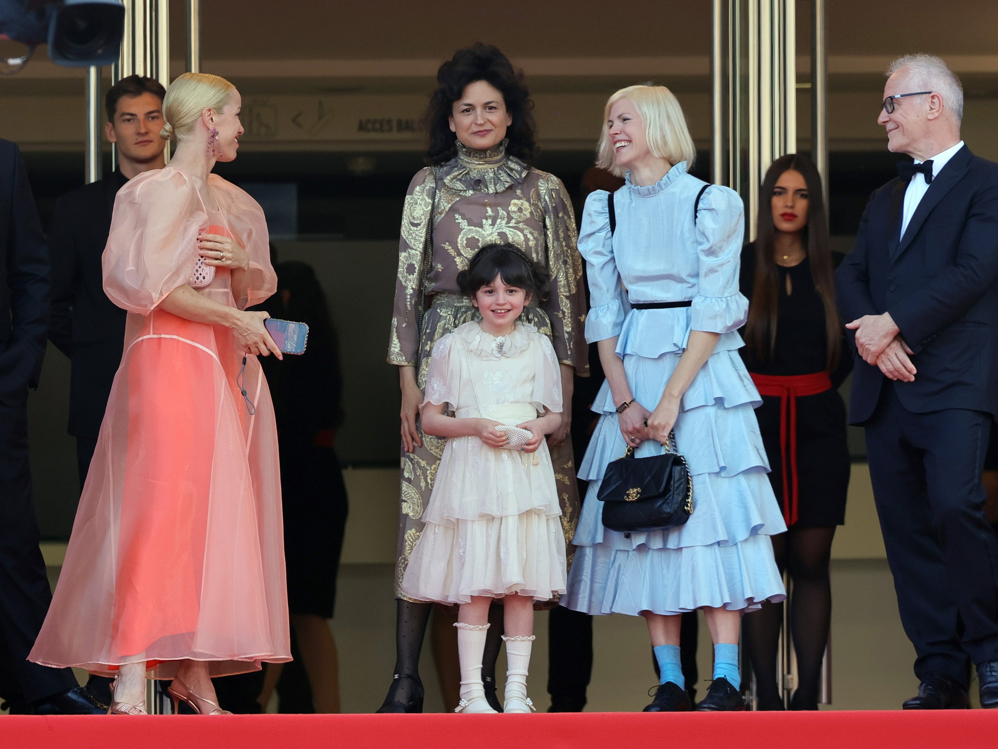 Centre: Freya Anderson and Juman Maloud attend the Asteroid City red carpet during the 76th annual Cannes film festival on 23 May 2023