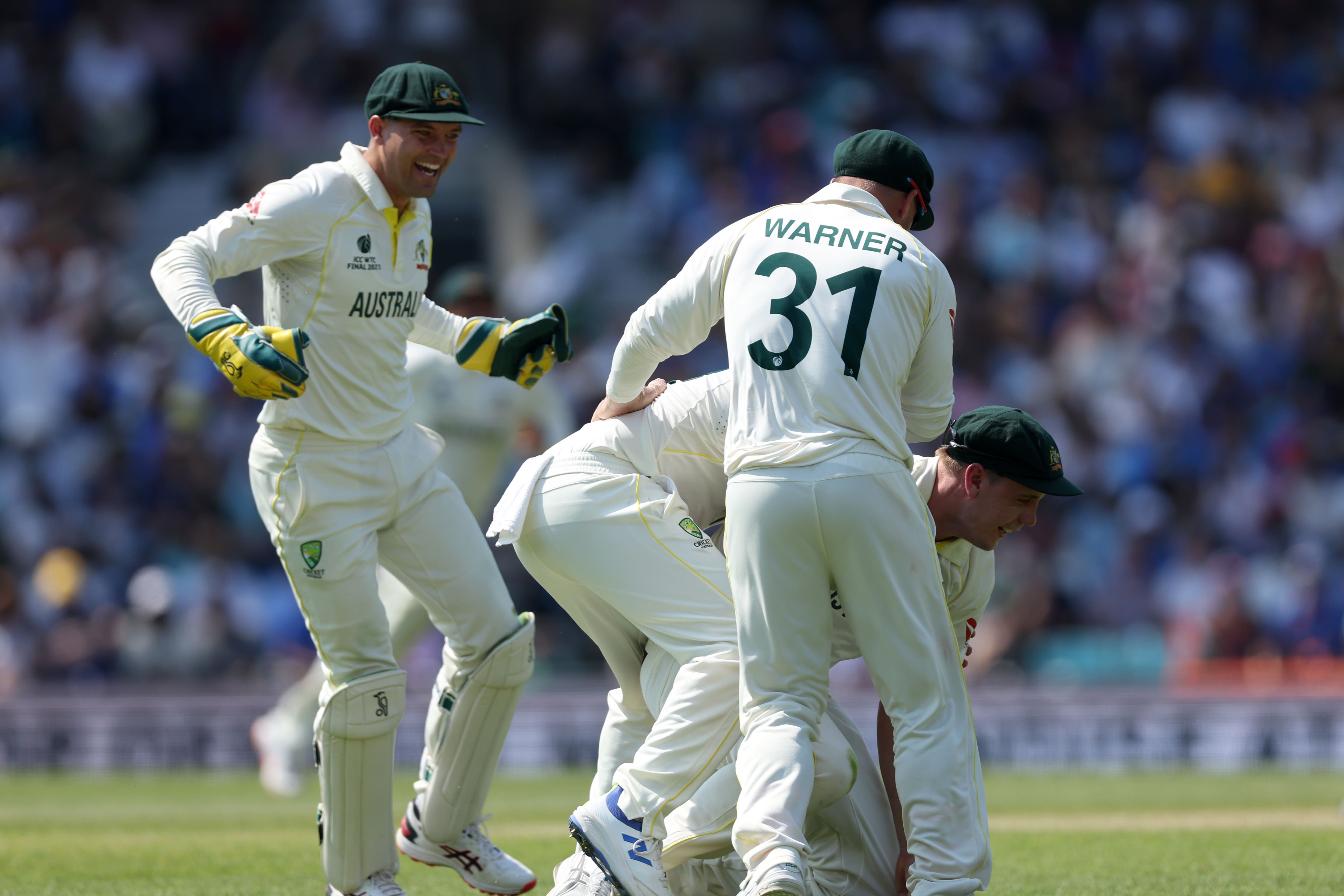 Australia’s Cameron Green (right) celebrates catching India’s Shubman Gill off the bowling of Scott Boland during day four (Steven Paston/PA)