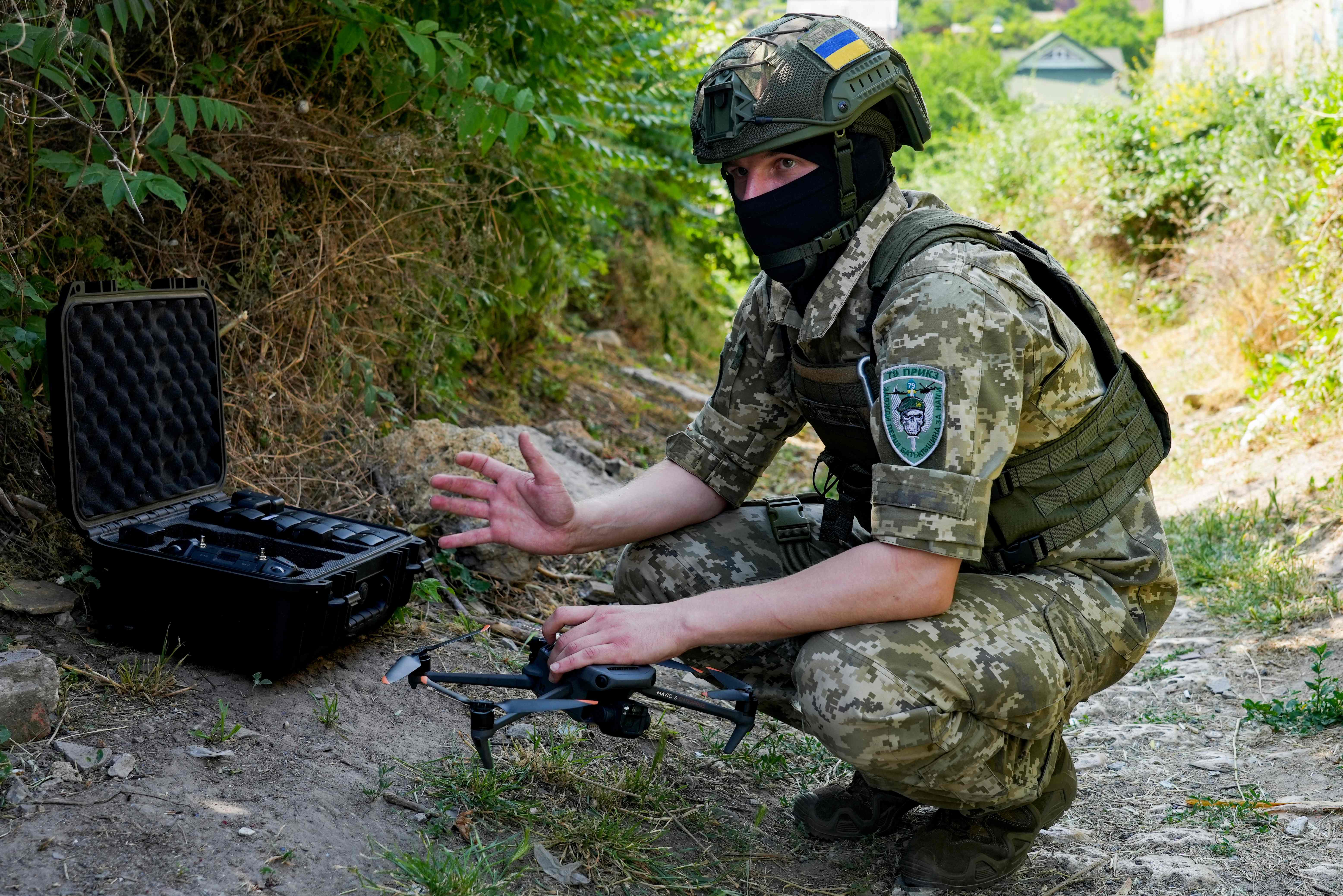 A Ukrainian serviceman preparing a DJI Mavic 3 drone, a model that is often used on the battlefield