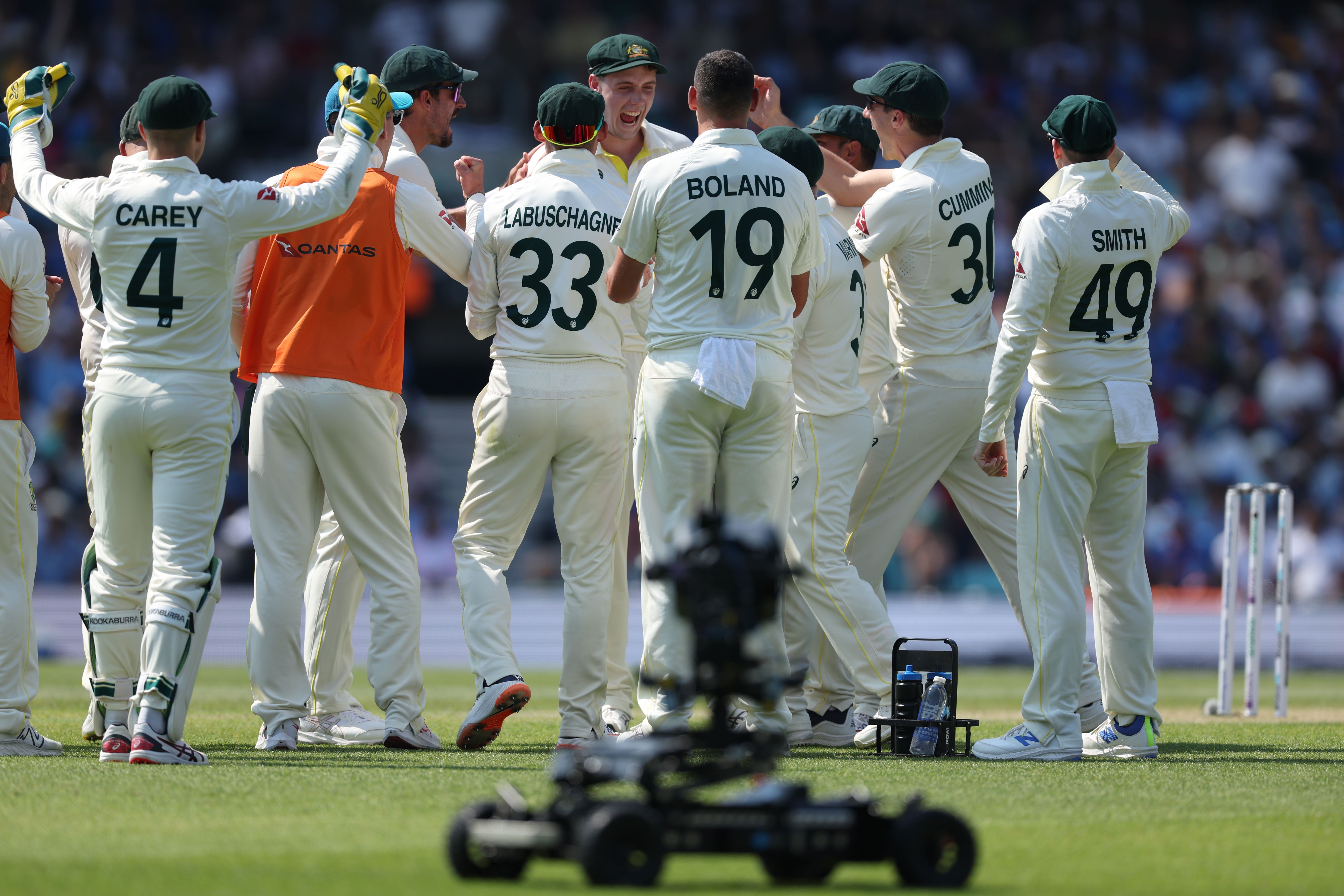 Cameron Green, rear centre, and Australia celebrate after his catch to remove Shubman Gill was upheld (Steven Paston/PA)