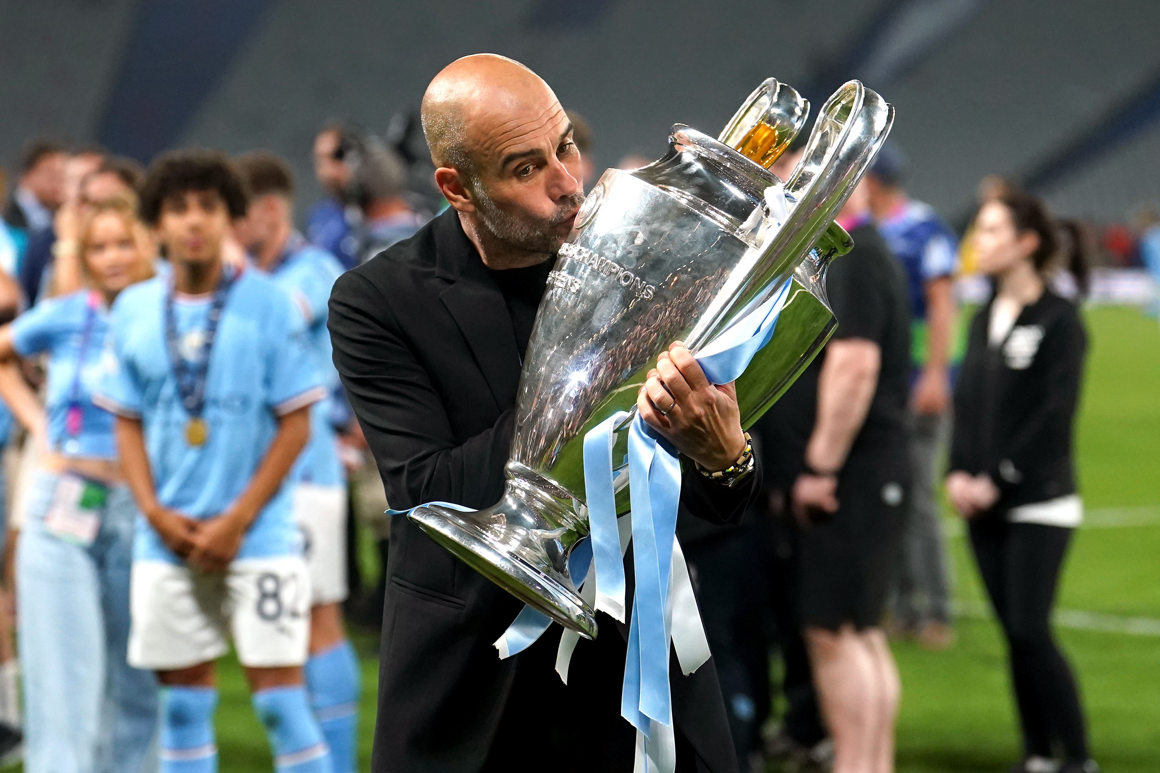 Pep Guardiola celebrates after winning the Champions League (Martin Rickett/PA)