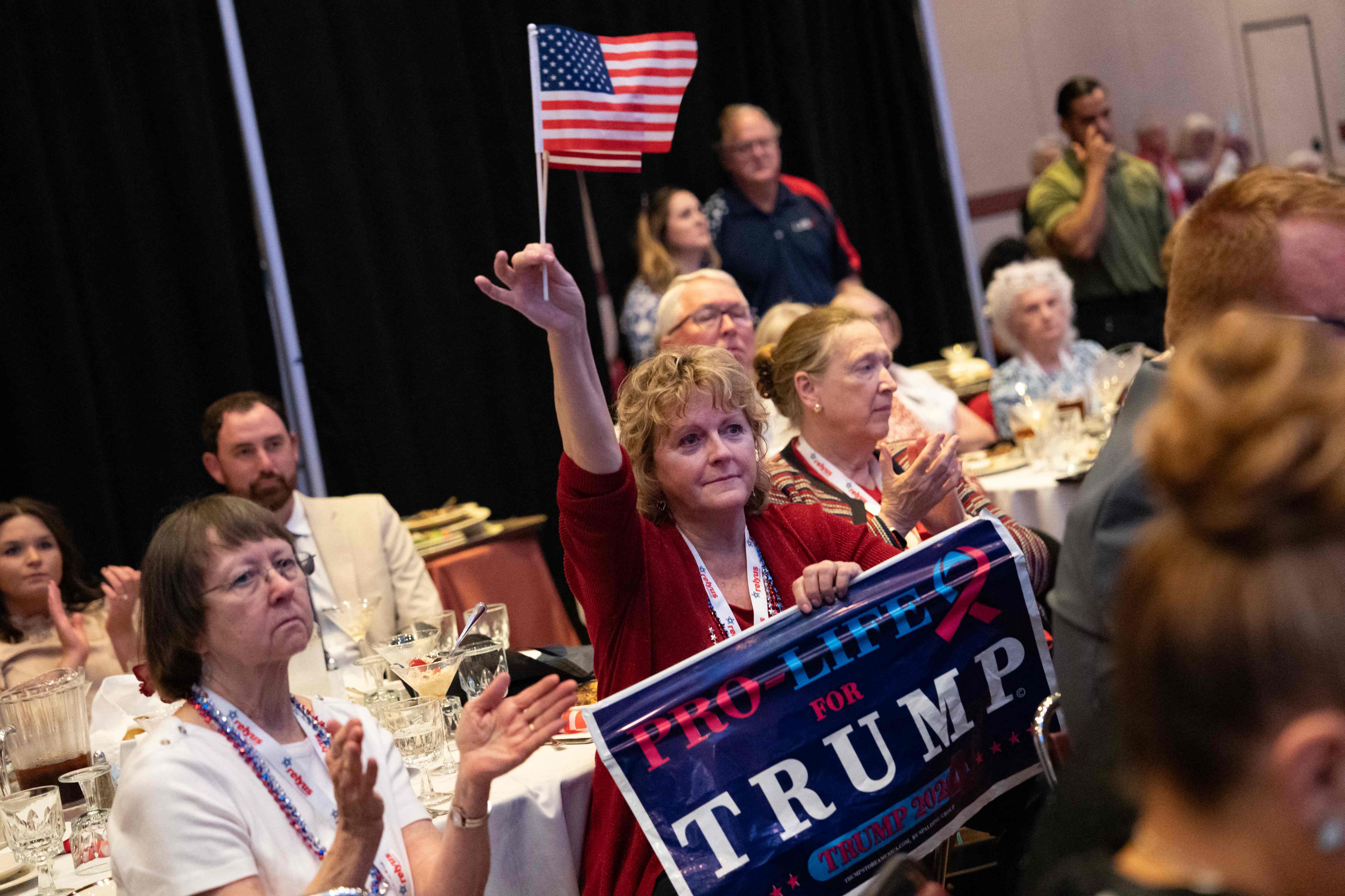 A woman holds a pro-life sign as she listen to Former US President and 2024 Presidential hopeful Donald Trump speak at the North Carolina Republican Party Convention in Greensboro, North Carolina, on June 10, 2023. (Photo by ALLISON JOYCE / AFP) (Photo by ALLISON JOYCE/AFP via Getty Images)