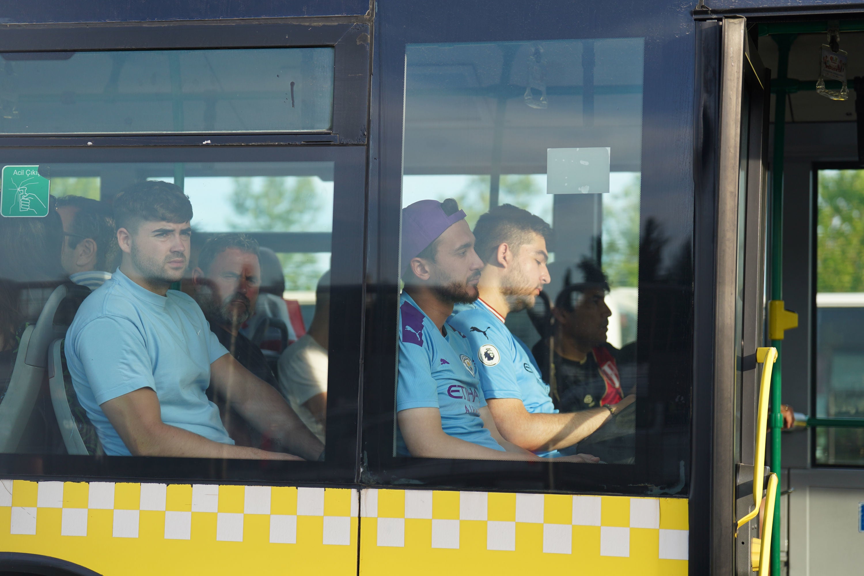 Man City fans on a shuttle bus as they head to Ataturk Olympic Stadium