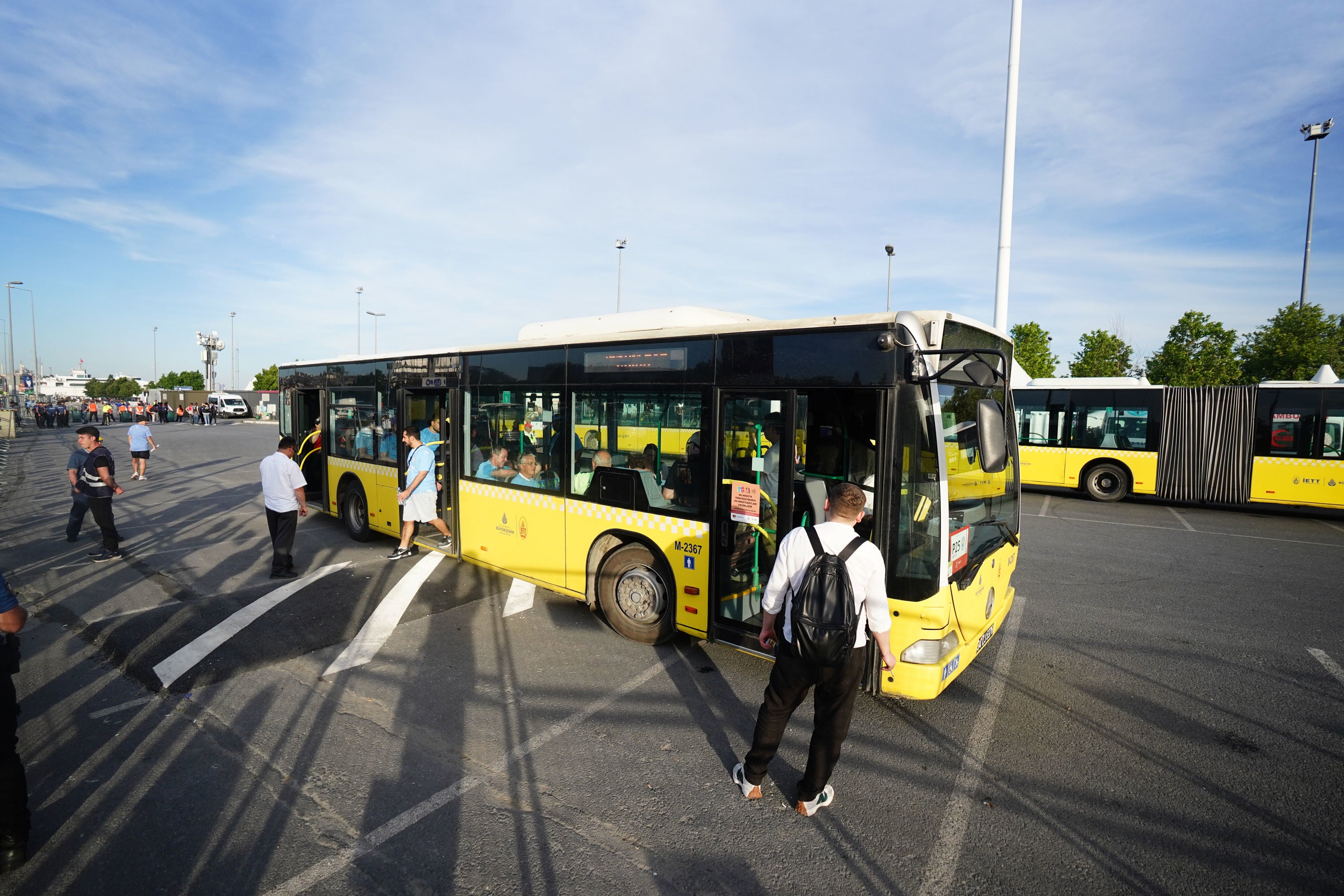 Man City fans on a shuttle bus as they head to Ataturk Olympic Stadium