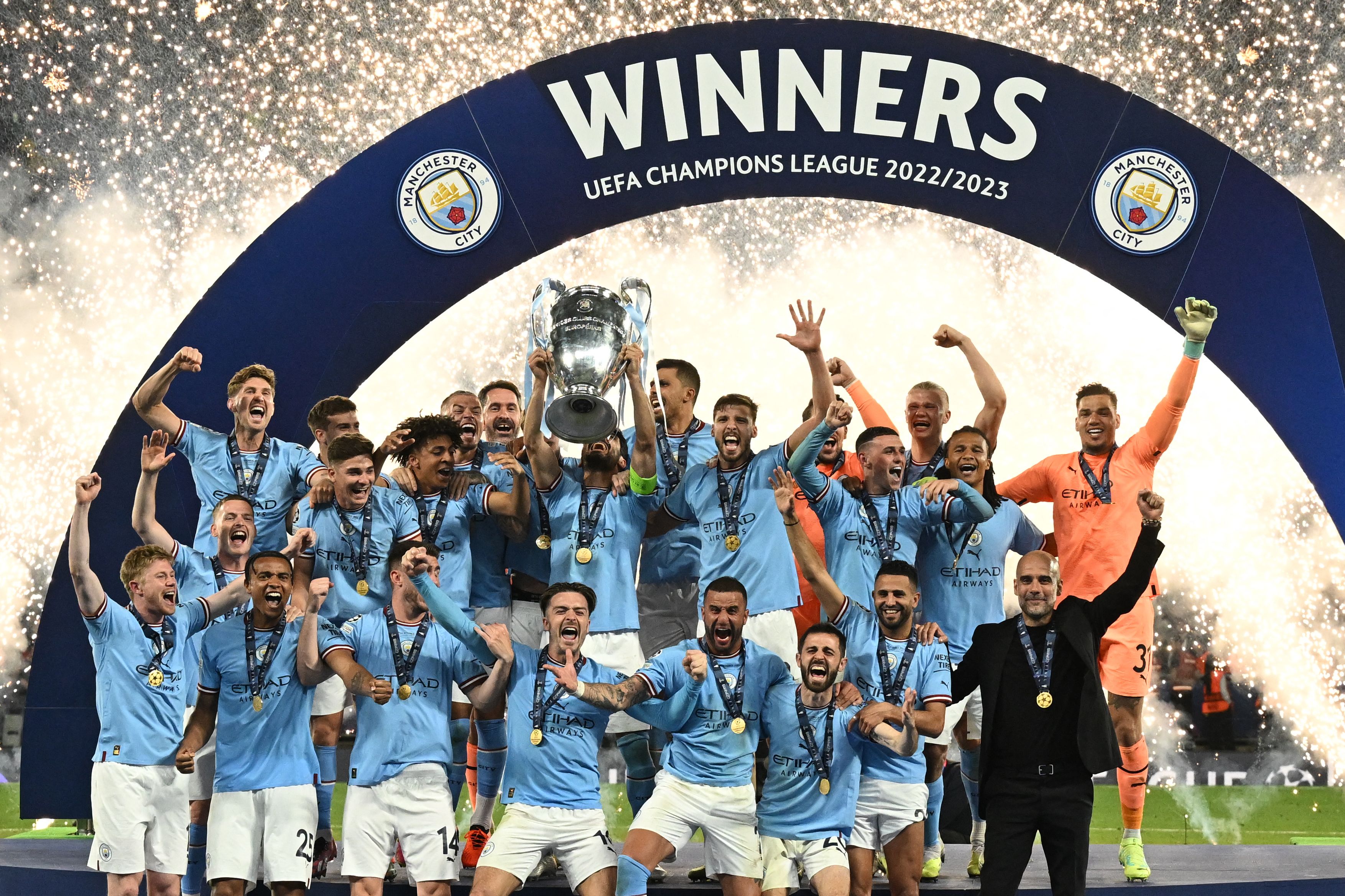 Manchester City celebrate with the trophy