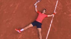 Watch: Emotional moment Novak Djokovic lays down on tennis court after historic French Open win