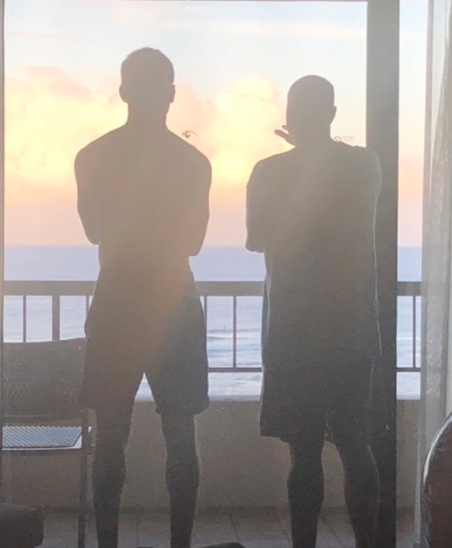 Austin and his father looking at the sunset